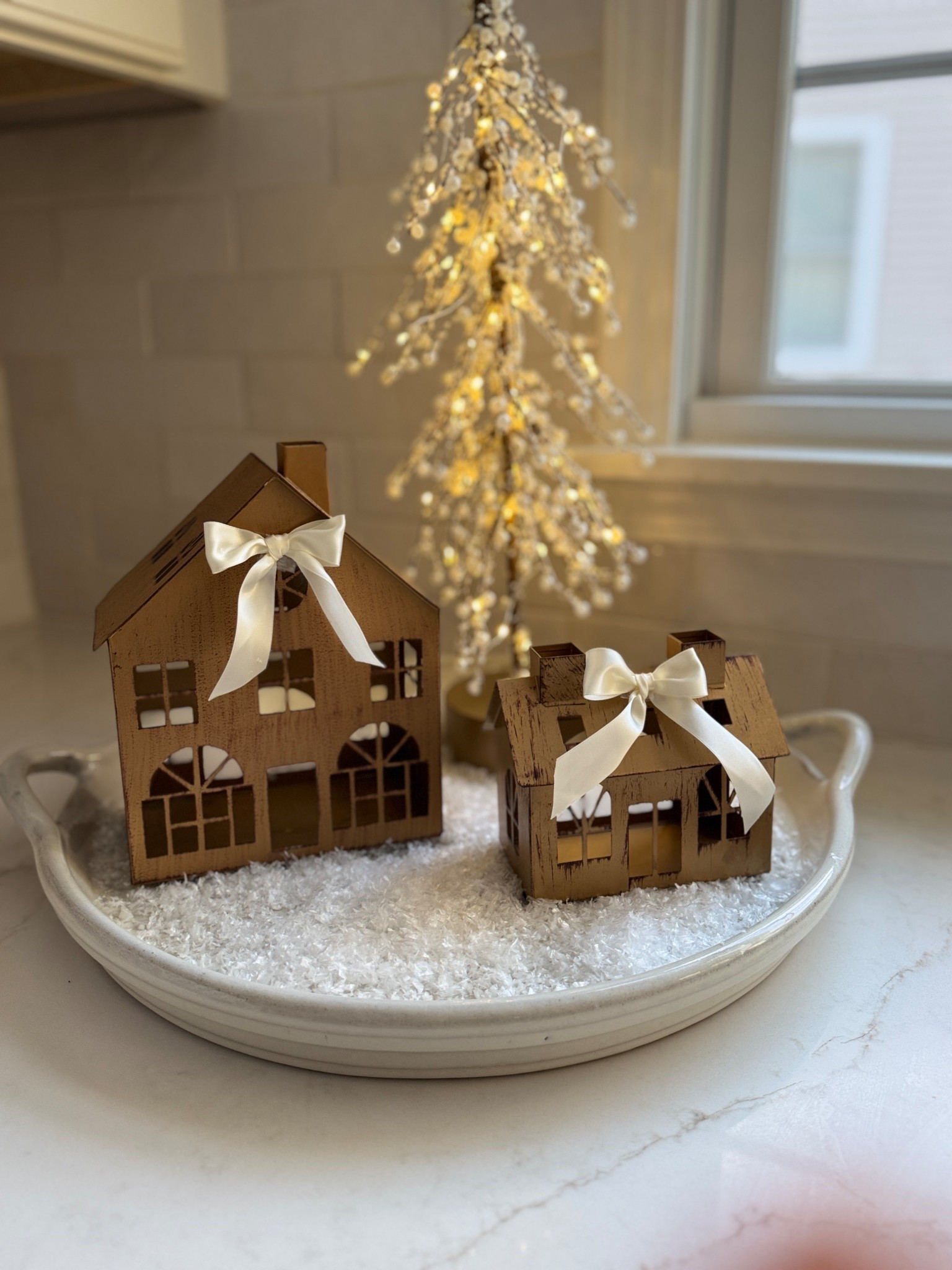 ✨ Cozy little Christmas village moment ✨
Gold houses, twinkle lights, and a sprinkle of “snow” simple magic that makes the whole kitchen feel festive 

#LTKHoliday