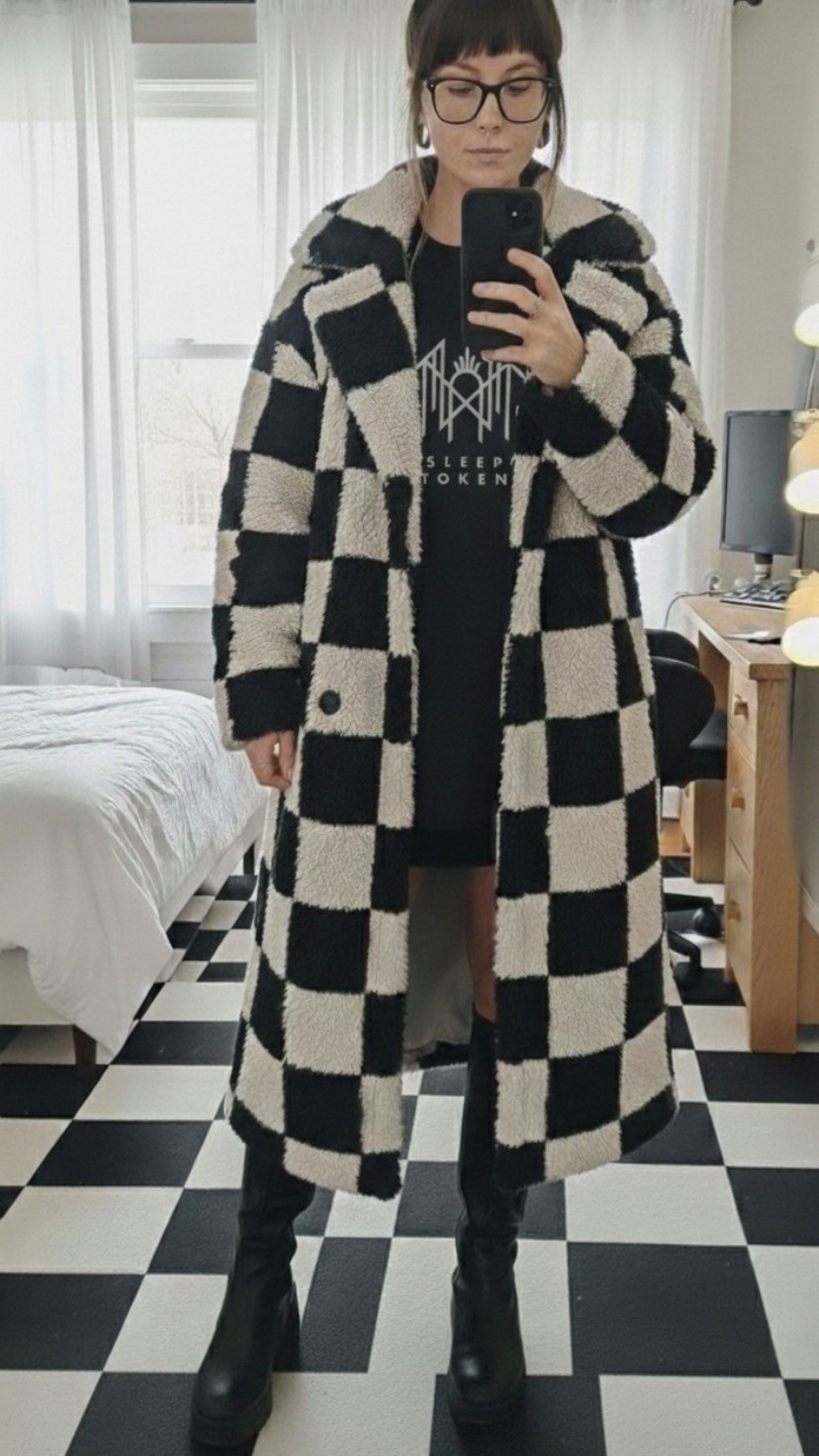 Checkered Dreams & Alt Vibes 🏁
Obsessed with this black and white checkerboard sherpa coat! It’s the perfect statement piece to level up a casual band tee and boots look. I’m wearing a size large for that perfectly oversized, cozy fit.

Shop the look:
• Checkerboard Longline Sherpa Coat
• Sleep Token Graphic Tee
• Platform Knee High Boots
• Chunky Black Frames
#LTKstyletip #LTKunder100 #LTKseasonal #checkerboard #winteroutfit #altfashion #bandtee #streetstyle

#LTKSeasonal #LTKMidsize #LTKootd