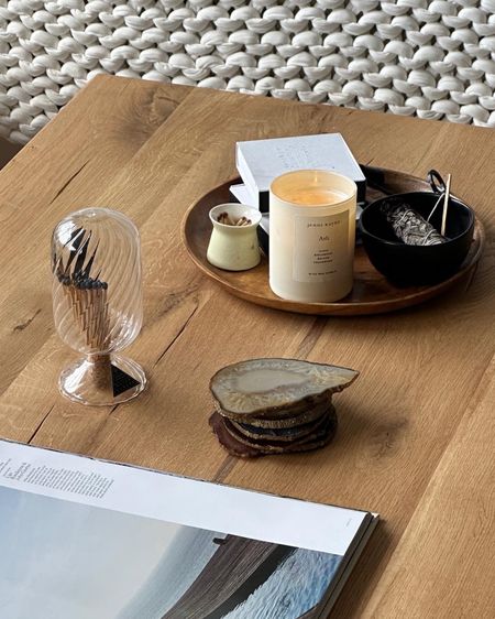 Coffee Table styling details: 

AD Coffee Table Book • Jenni Kayne Candle (use ASHLEY15 for 15% off) • agate coasters • round acacia tray • match cloche • matte black candle wick trimmer 

#LTKunder100 #LTKunder50 #LTKhome