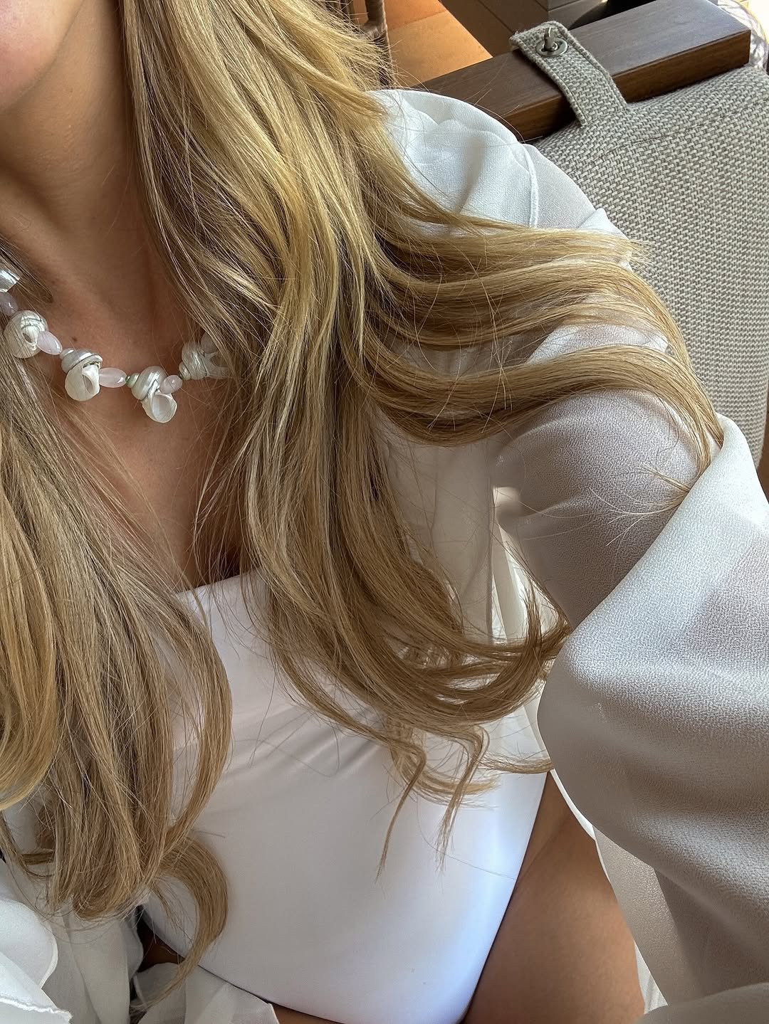 Seaside serenity. This crisp white beach look features a classic one-piece swimsuit layered with a sheer cover-up and accessorized with a stunning baroque pearl and rose quartz statement necklace. #BeachStyle #SummerAccessories #LTKswim 

 #LTKdayinmylife #LTKgrwm #LTKootd