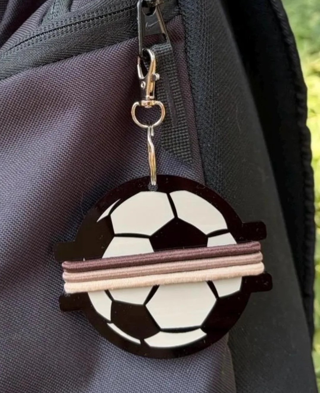 Soccer ball hair tie holder

#LTKdayinmylife #LTKBeauty #LTKKids