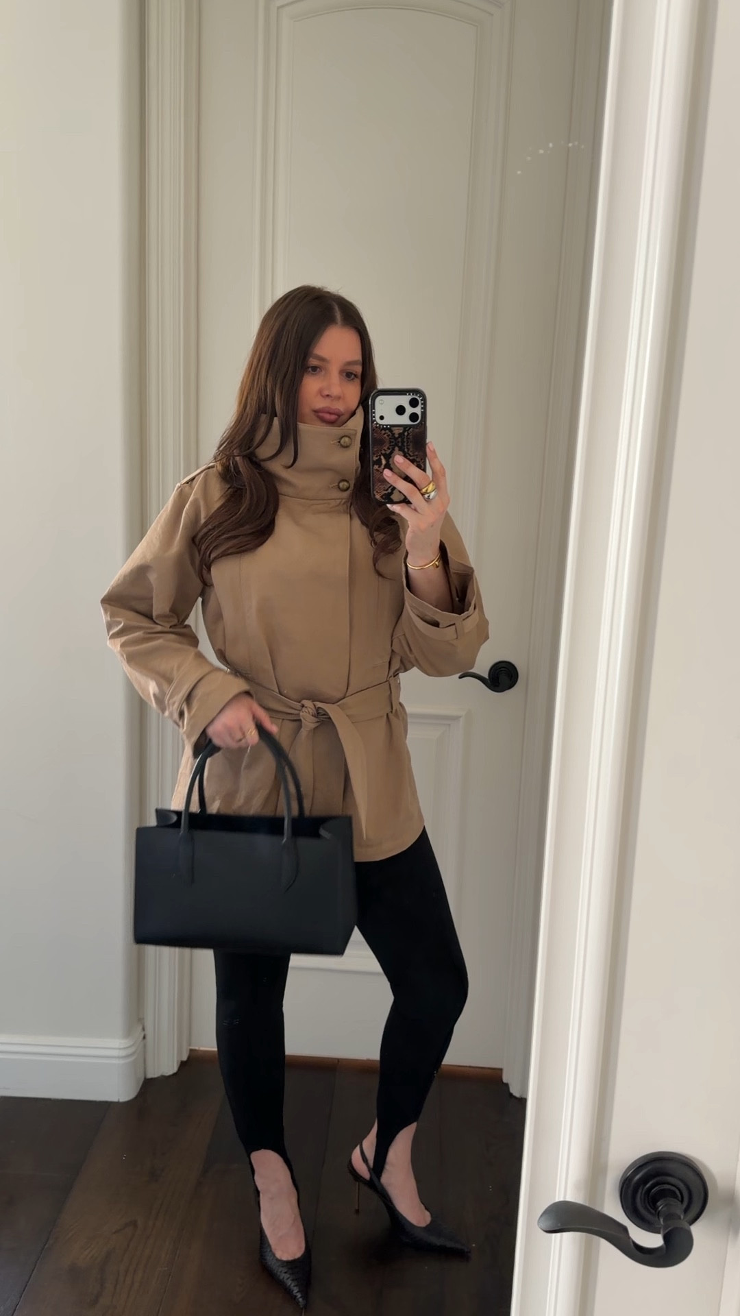 Styling @Revolve funnel neck trench coat with black leggings, black sling backs and a small black leather tote. Adding gold jewelry to elevate the look. 

#outfitidea #outfitinspo #highneck #funnelneck #springoutfit #trenchcoat #leggings #tote #zara #revolve 

#LTKgrwm #LTKootd #LTKWorkwear