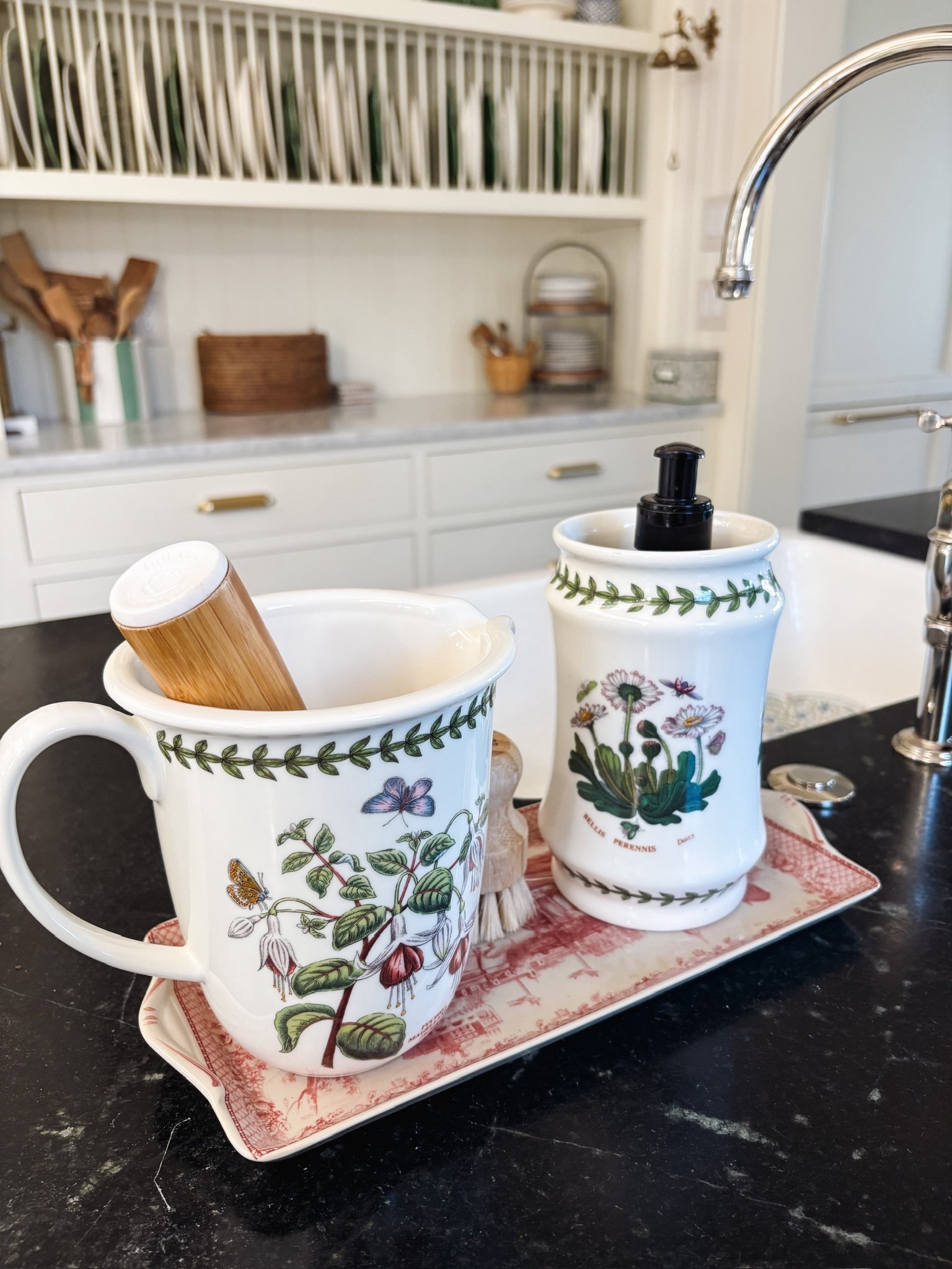 Botanical crock holding hand soap, a measuring jug holding the dish brush, and a charming red and white underneath. Functional but charming and such a happy sight while we do dishes!

#LTKSeasonal #LTKHome #LTKSaleAlert