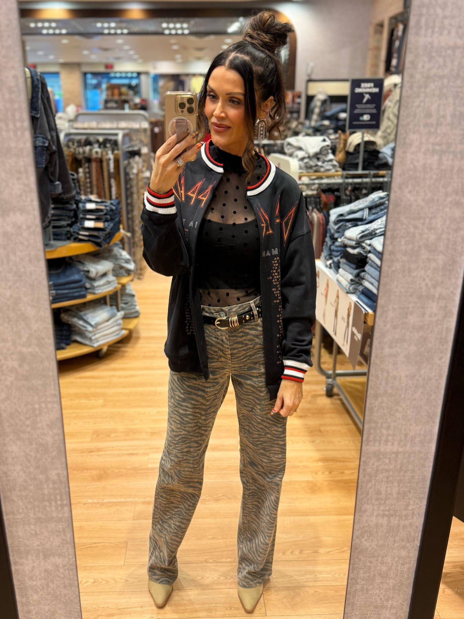 Def Leppard graphic cardigan
Sheer polkadot top 
Black tank top bra 
Black studded belt 
Tiger print jeans 
Sand colored booties 
All pieces are from the buckle 

#LTKGiftGuide #LTKootd #LTKFindsUnder100