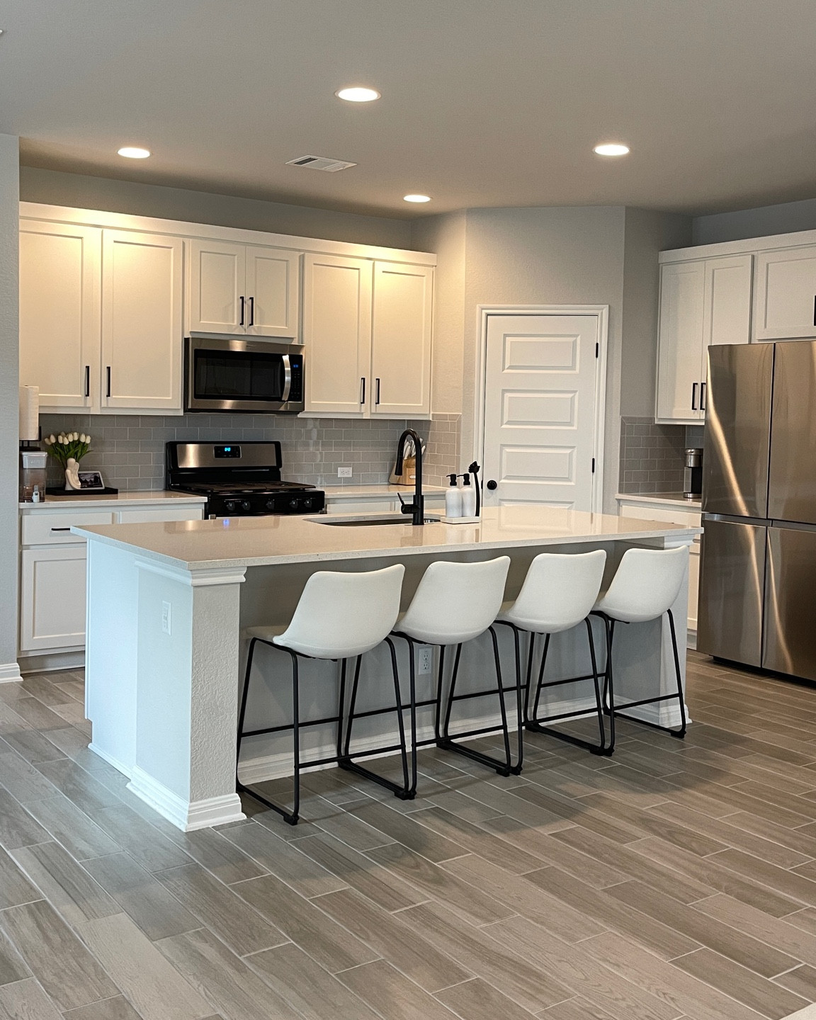 Barstools, black matte faucet and decor linked 