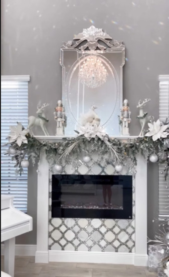 Winter wonderland vibes ❄️✨ I linked every glam detail of this frosty mantel on LTK, from the garland to the nutcrackers and sparkly accents. Tap to shop the full look! #LTKHoliday #LTKHome 

 #LTKHoliday #LTKActive #LTKBeauty