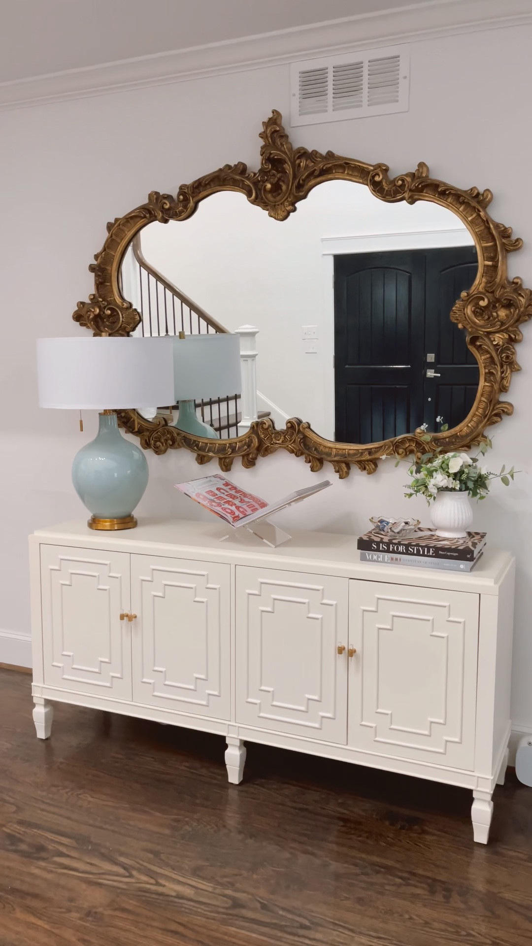 Cabinet style. Christmas decor. Side table decor. Entry way table. Blue lamp. Acrylic book stand. Modern decor. Living room decor. Ballard designs. Gold mirror. Ornate gold mirror. Kurt Adler nutcracker. Pink nutcracker  #LTKHoliday 

#LTKSeasonal #LTKhome