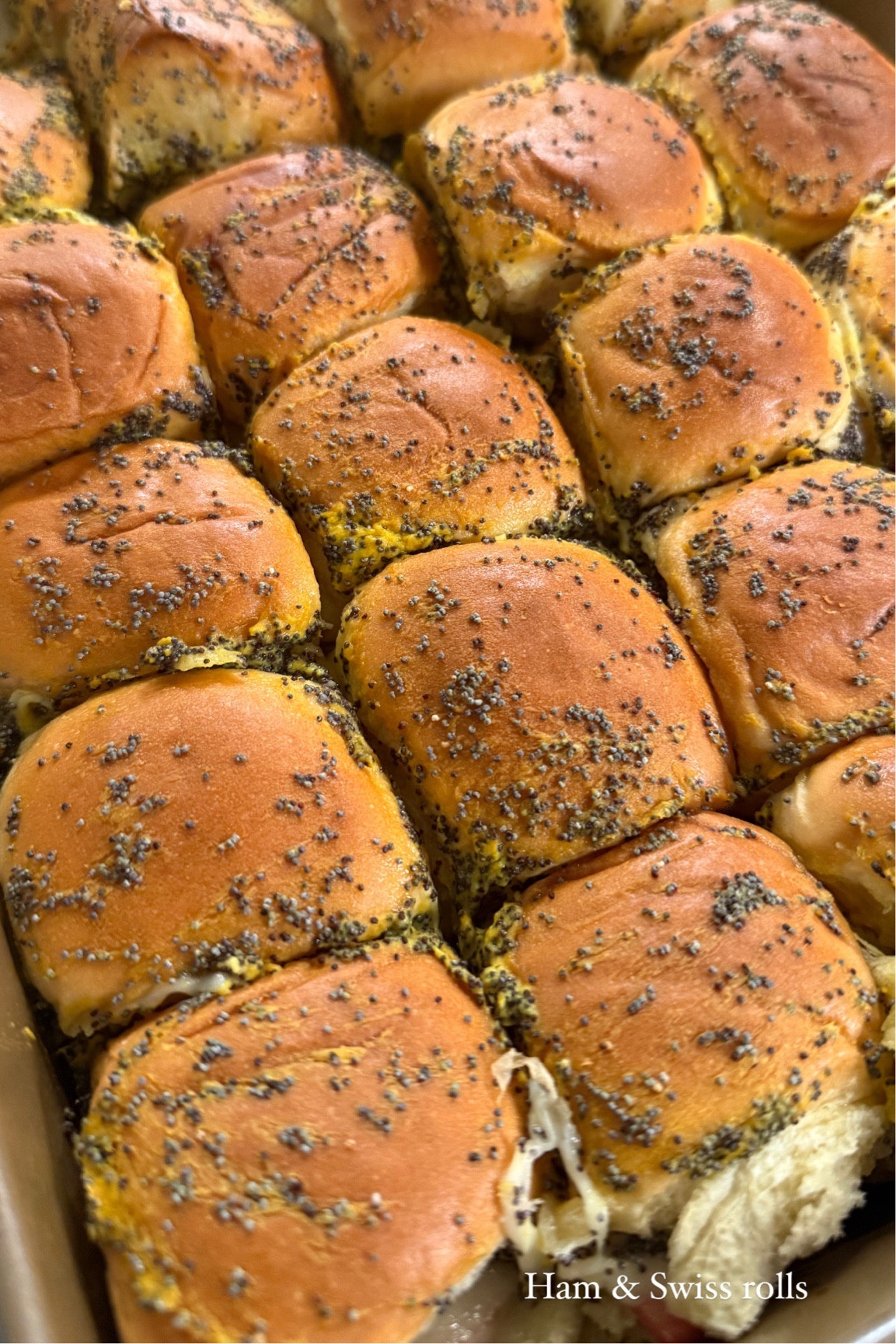 Ham & Swiss Rolls- mixture of butter, poppy seeds and mustard of choice on top. 

#LTKHoliday #LTKSeasonal #LTKTravel