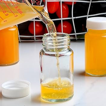 8 Pack 4 oz Glass Juice Bottles with Caps, Reusable Clear 120 ml Empty Wellness Shot Glass Bottle... | Amazon (US)