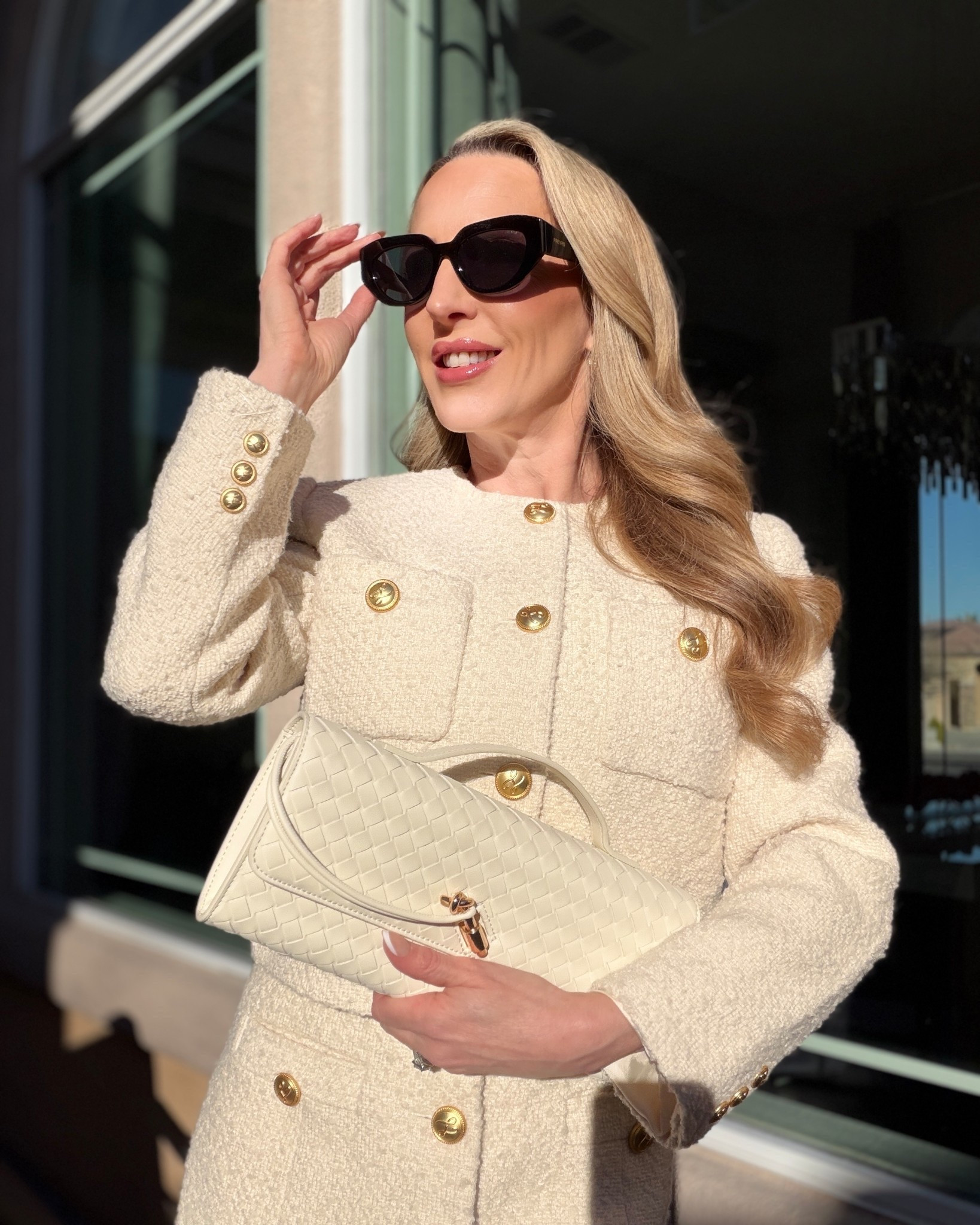#ad Elegant OOTD: 2026 sunglasses trends include statement oversized cat eye sunglasses like these retro black FREYRS Sunglasses that are so glam and provide so much sun protection. Styled with a cream boucle mini dress, matching cream blazer with gold buttons and white woven clutch bag. 

#LTKootd #LTKSeasonal #LTKWorkwear