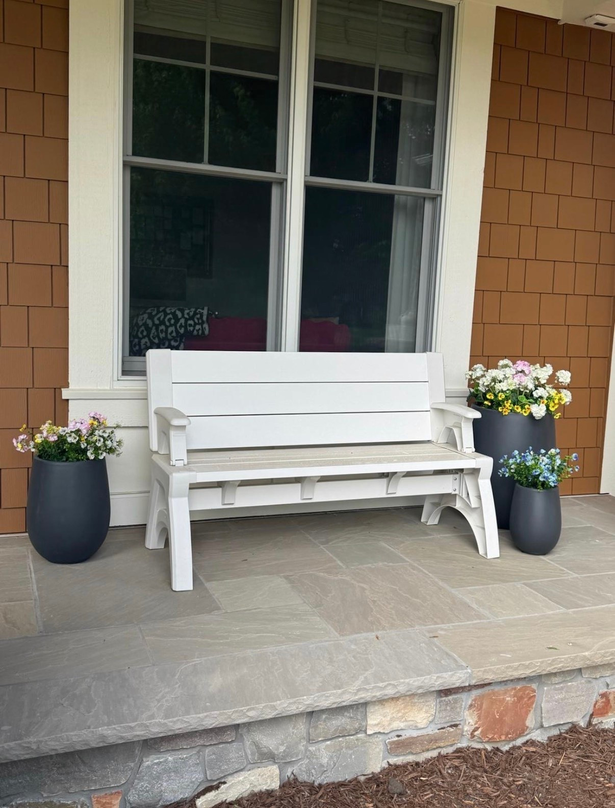 With the weather getting warmer I wanted to share my convertible bench I have on my porch that is sooo good you guys! I set it up with these new planters I got from @Wayfair 

 #LTKSeasonal #LTKHome