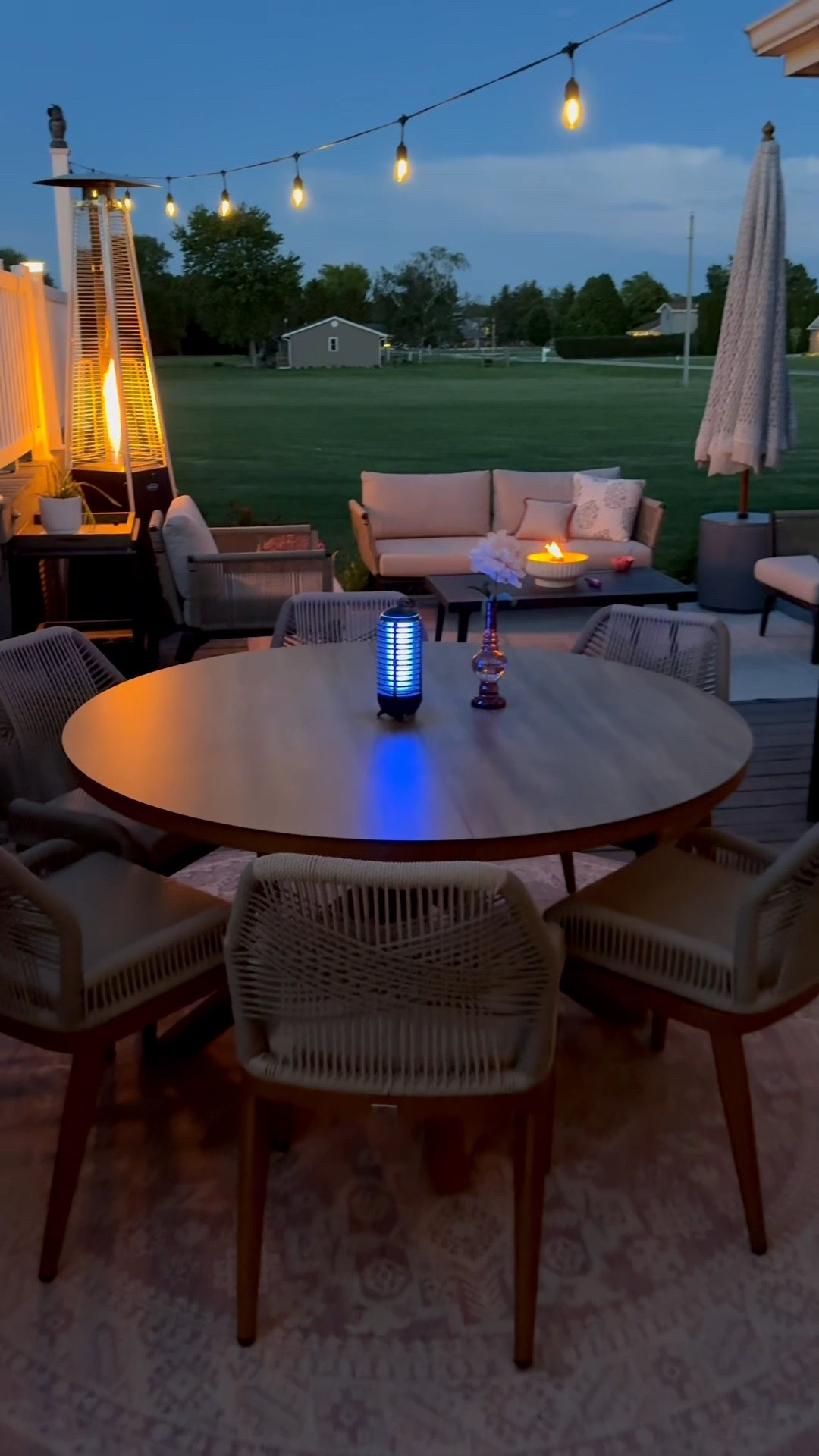 Back deck decor 
All weather aluminum table and all weather rattan chairs 
Macrame umbrella 
Outdoor heater 
Bug zapper