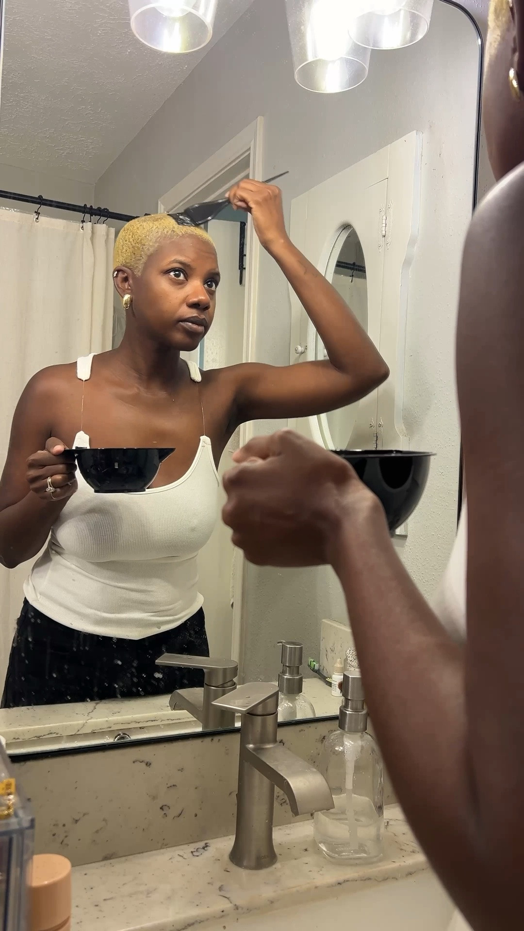 This is how I go from black to blonde hair with my buzz cut. Mix 1 ounce of powder lighter with 2 ounces of your developer. Leave it on for the max amount which is usually 40 to 45 minutes to get your hair as light as possible on the first round. It really depends on what your scalp can handle if it is sensitive. The next day if you have gotten your hair light enough the first time, tone it with Wella T 14 for 20 or so minutes. Check the color every 5 to 10 minutes to be sure it is the shade that you like. Shampoo out the color, fully and condition your hair. ￼
