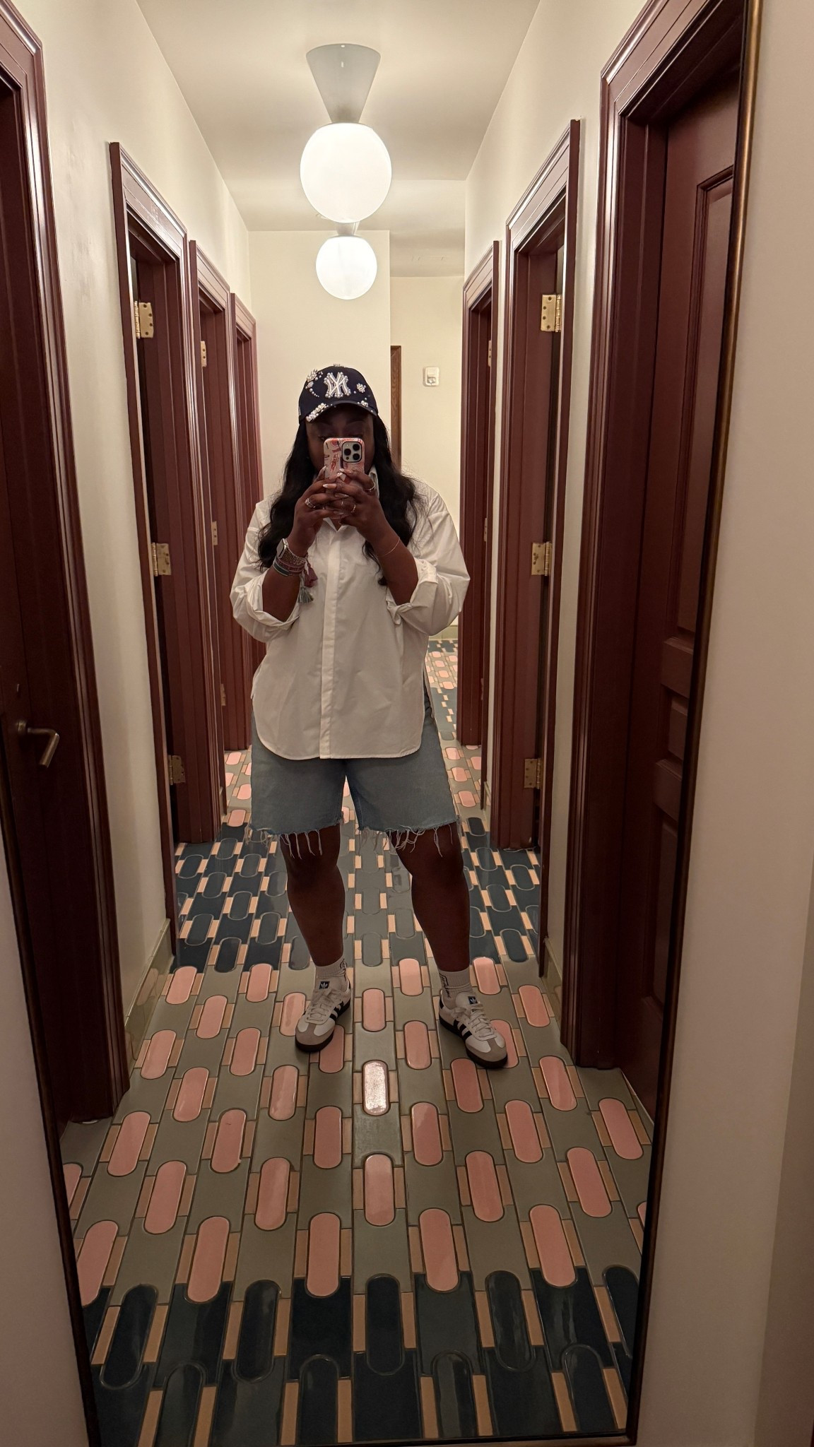 Long denim shorts, white button up, Yankees 

#LTKShoeCrush #LTKMidsize #LTKStyleTip