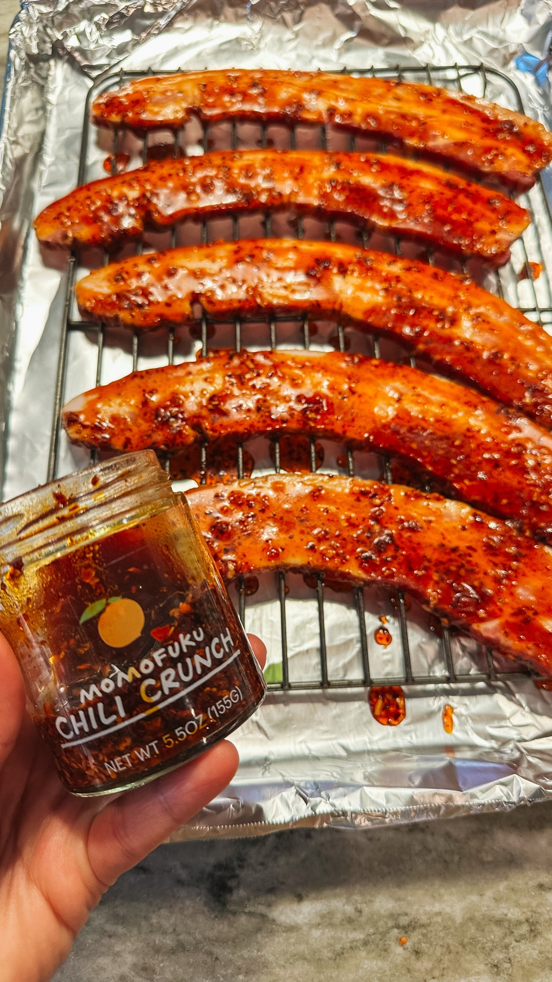 🥓If your family loves bacon🥓you have to try this Billionaire Bacon recipe using the Chili Crunch from Momofuku. 
Just brush the chili crunch over bacon and bake for a caramelized, crispy, restaurant-worthy bacon that’s perfect for weekend brunch, holiday entertaining, game day snacks, or an easy crowd-pleasing appetizer. It’s smoky, sweet, spicy, and honestly one of the best bacon upgrades I’ve ever made.

If you’re looking for easy appetizer ideas, gourmet pantry staples, viral chili crunch recipes, or ways to elevate bacon at home, this is the one to try. Linking the chili crunch here because once you taste it, you’ll want it on everything.

#LTKvlog #LTKHome #LTKfoodie