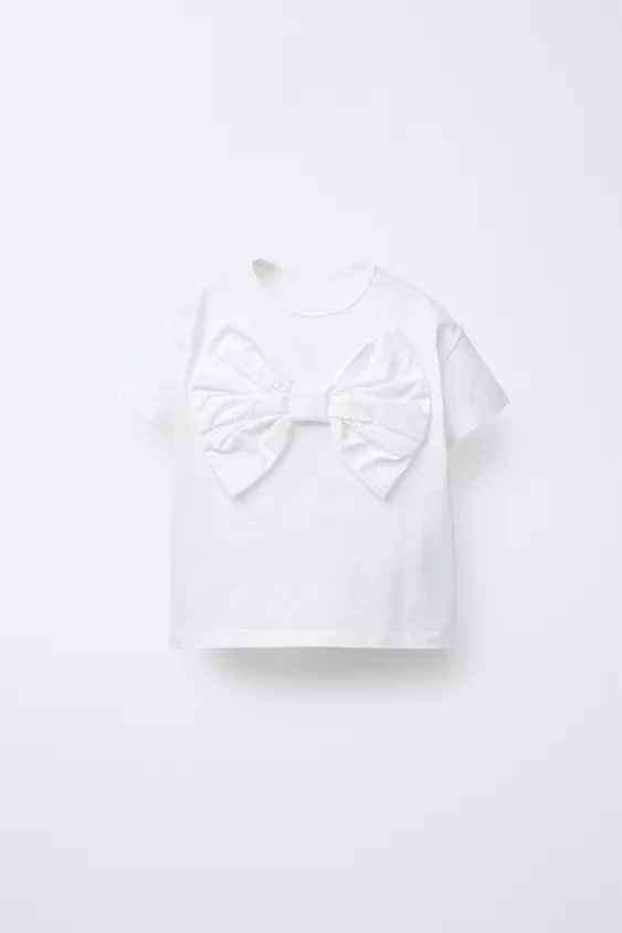 T-shirt with round neck and short sleeves. Front poplin bow appliqué. | Zara US