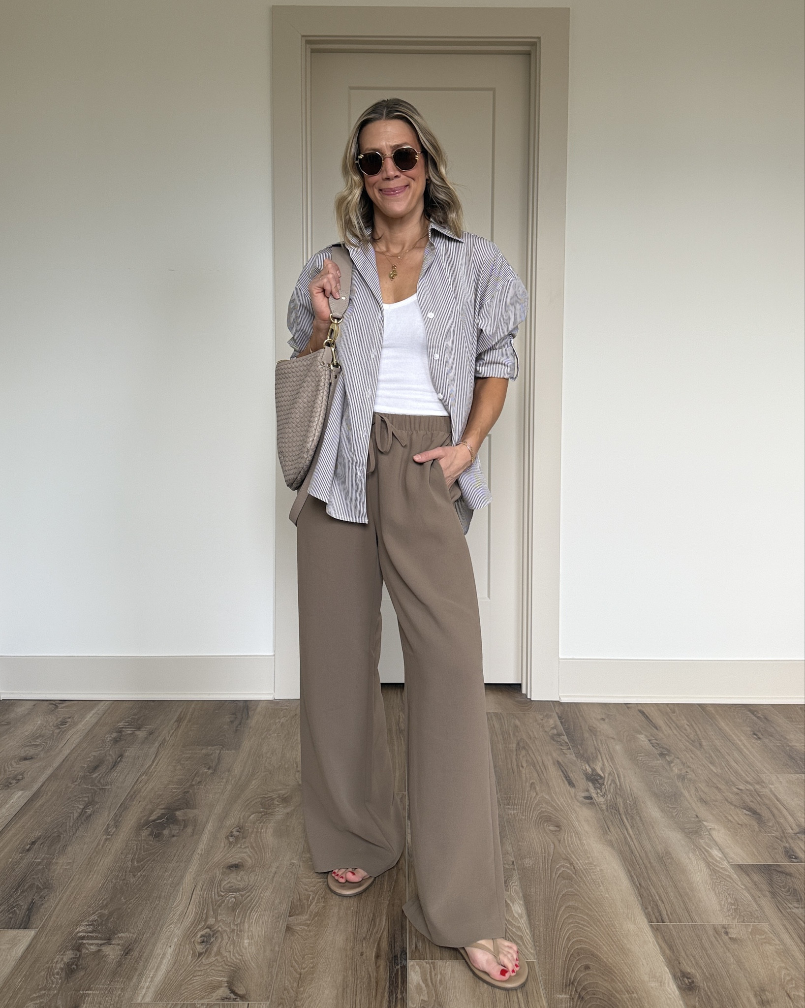 Wearing XS button-up shirt, XS tank, small pants, sandals tts

#LTKOver40 #LTKootd #LTKgrwm