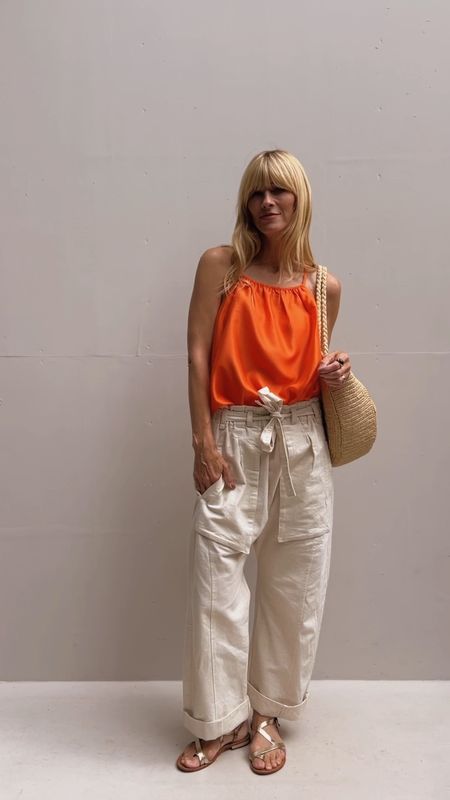 Orange strap top, linen trousers, silver sandals, beach tote straw bag 

#LTKHoliday #LTKSeasonal #LTKtravel