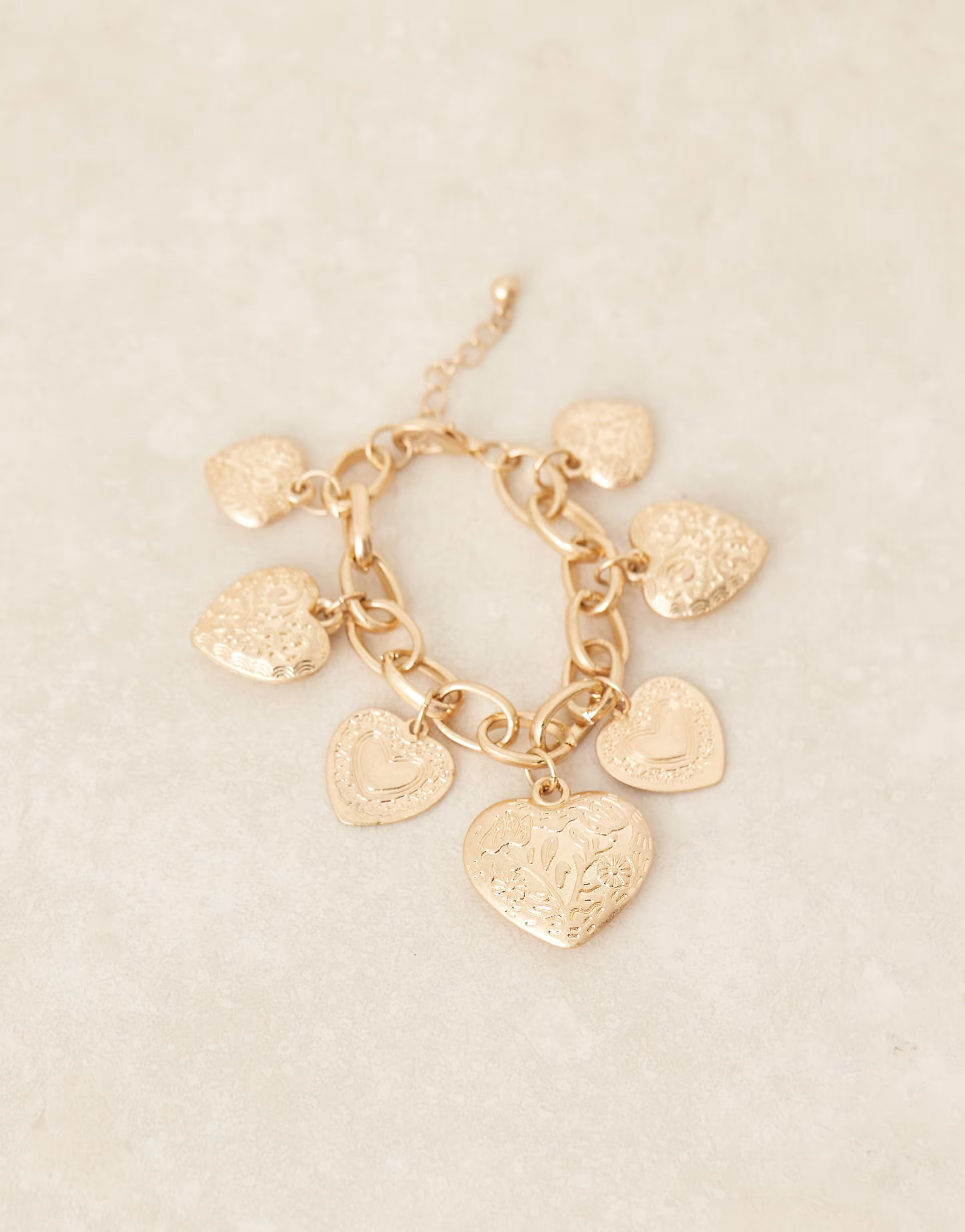 ASOS DESIGN chain bracelet with heart charms in worn gold tone | ASOS | ASOS (Global)