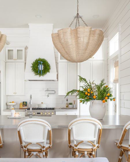 Our coastal kitchen decorated for Christmas with faux evergreen stems, orange branches and prelit birch branches! I also hung a wreath with light blue velvet ribbon on our range hood. Linking our indoor/outdoor rug, woven scalloped chandeliers and swivel counter stools as well!
.
#ltkhome #ltkholiday #ltkfindsunder50 #ltkfindsunder100 #ltkstyletip #ltkseasonal #ltksalealert

#LTKhome #LTKsalealert #LTKHoliday