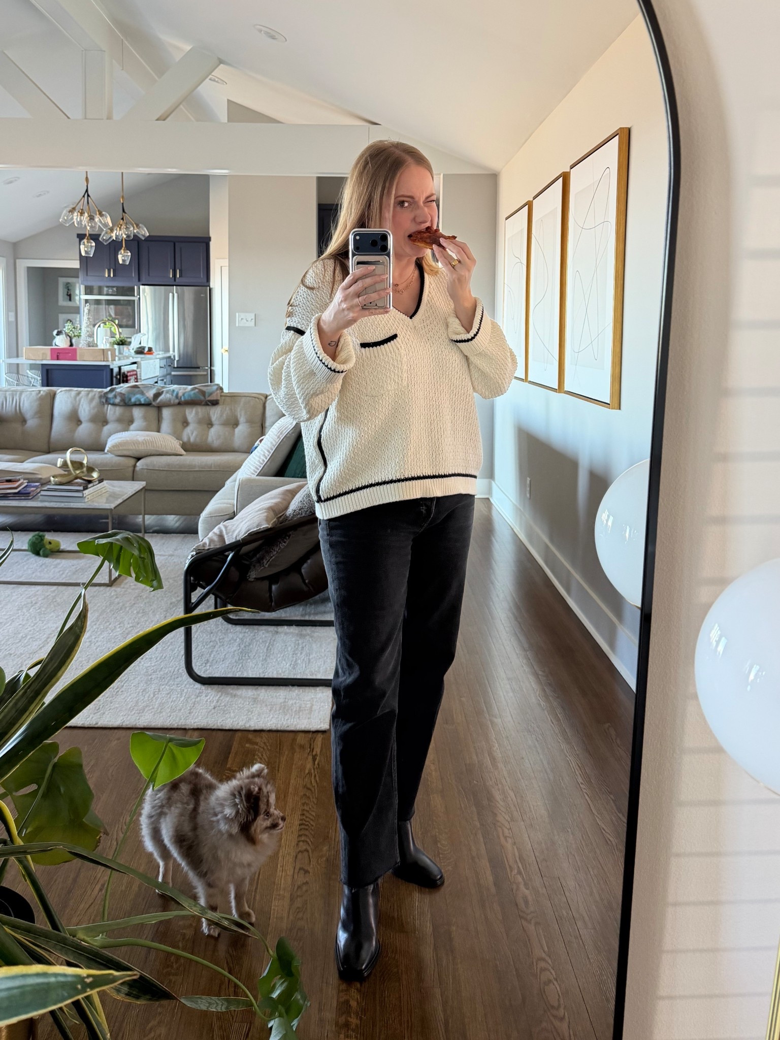 Every outfit is immediately improved by adding a slice of pizza to your hand. The perfect accessory. Cozy sweater by Sancia and britches by redone.