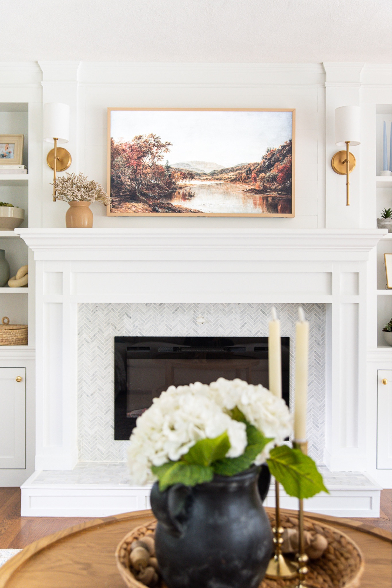 Fall home decor for your living room including artwork, sconces, coffee table, faux flowers, and vases

#LTKhome #LTKfamily