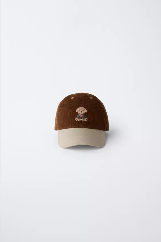 Cap with adjustable back closure. Embroidered dog detail on the front. | Zara US