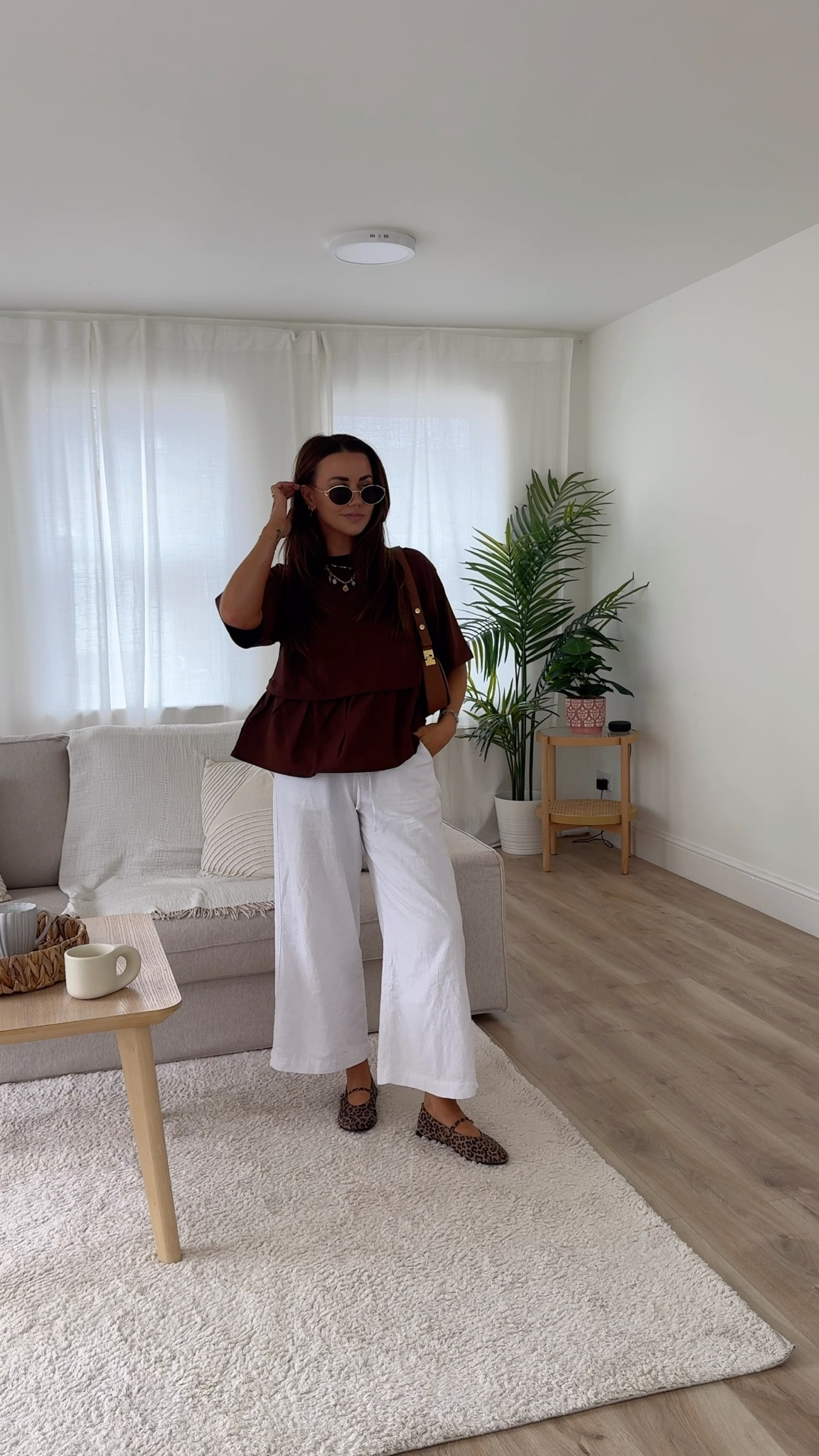 A simple summer outfit wearing miss selfridge brown oversized layered tshirt with marks and Spencer wide leg linen trousers and leopard print Mary Jane ballet flats for a transitional outfit idea 

#LTKuk #LTKsummer #LTKeurope