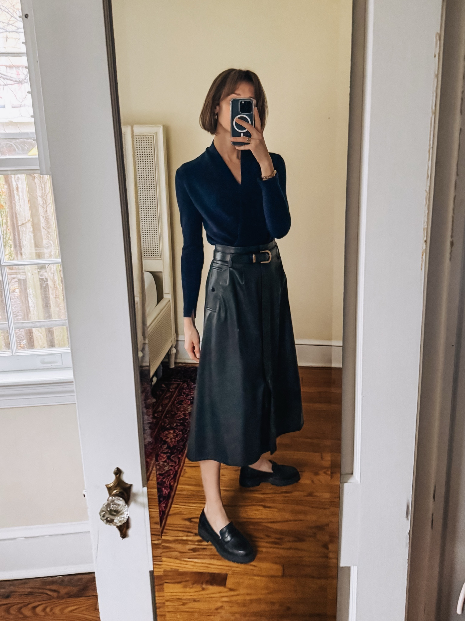 An easy and elegant work look with a navy wrap sweater, faux leather skirt & classic loafers. 

#LTKShoeCrush #LTKOver40 #LTKWorkwear