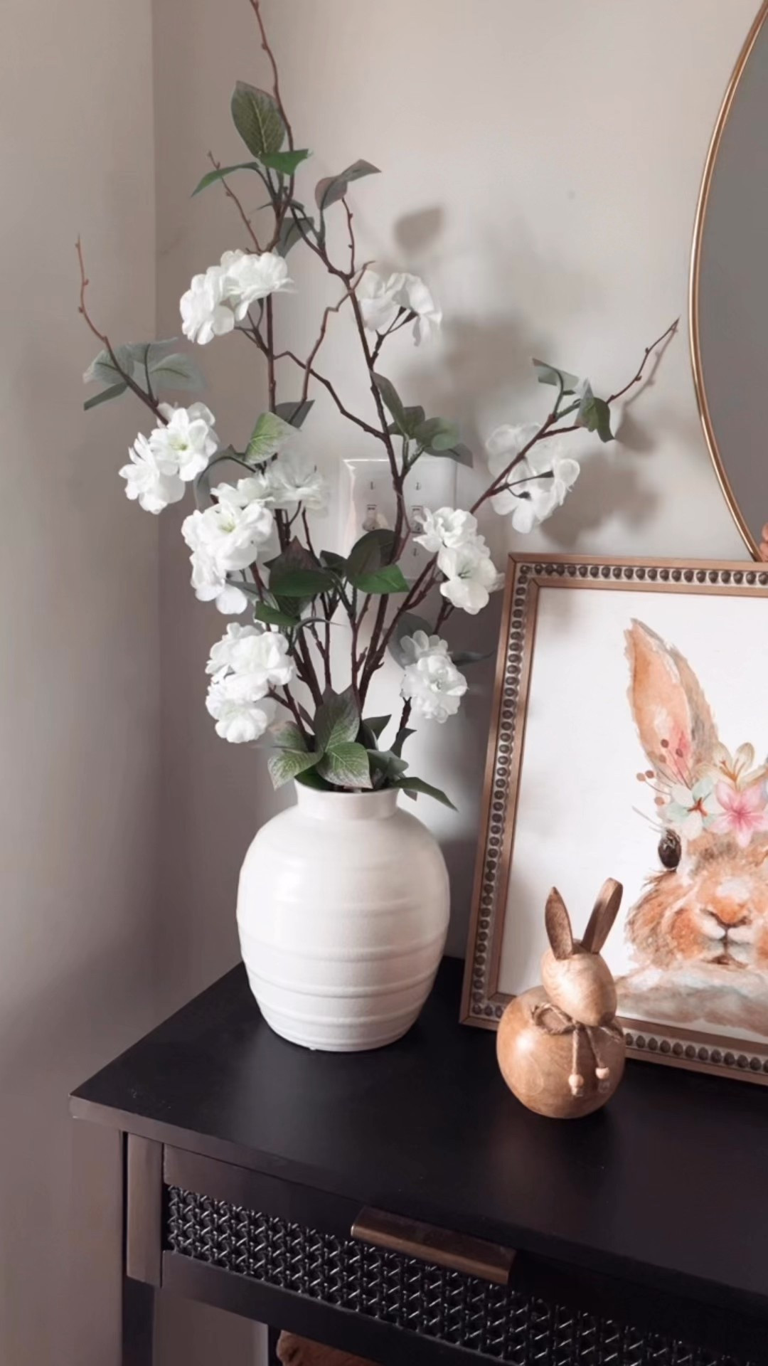 I just bought this beautiful vase from Walmart, they’ve really stepped up their home decor game! The cherry blossom stems are also from Walmart but I got them last year. Same for the artwork. The wood rabbit is a recent TJMaxx find. #spring entryway decor home finds walmartfinds 

#LTKHome #LTKFindsUnder50