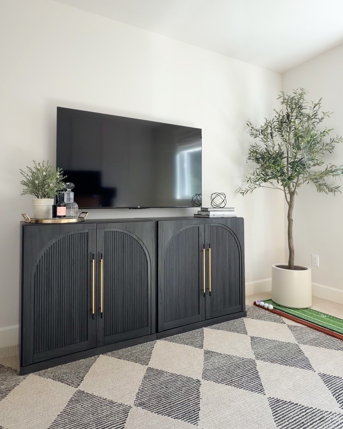 Upgrading my husband's office with the new TCL F8D TV!

TV wall mount, cable management, rug, Palladium Golf Putting Mat, artificial olive tree, cabinet

#LTKsummer #LTKhome #LTKmens