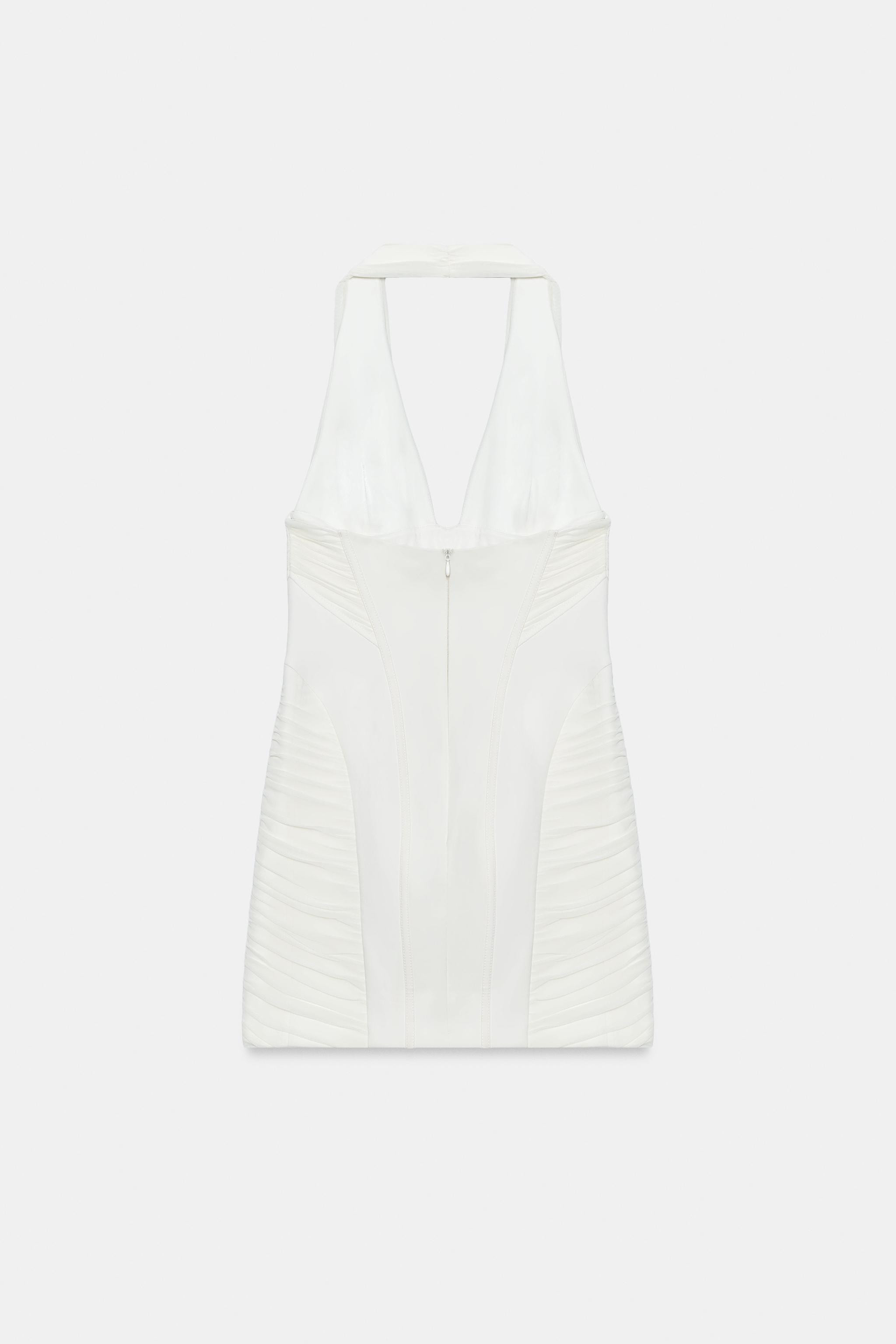 Halter neck dress with V-neckline. Draped combination fabric detail. Tonal matching interior lini... | Zara US