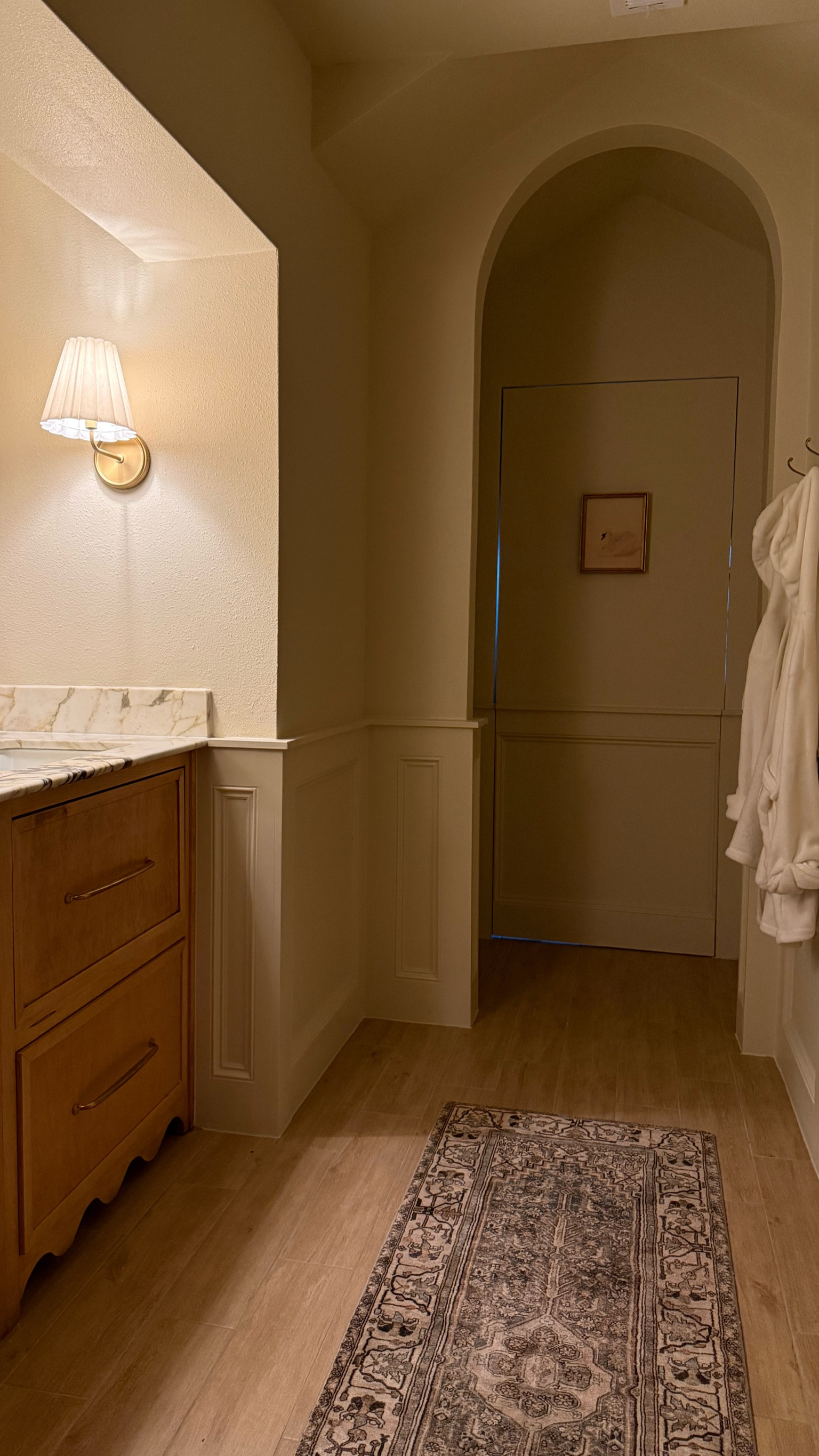 2025 home trends: bathroom 
Sconce, rug, art

#LTKHome #LTKStyleTip