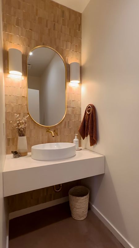 Small powder bath with a big impact - zellige tile - brass accents - oval bathroom mirror - vessel floating sink - bathroom remodel - neutral home decor - home decor 

#LTKstyletip #LTKhome