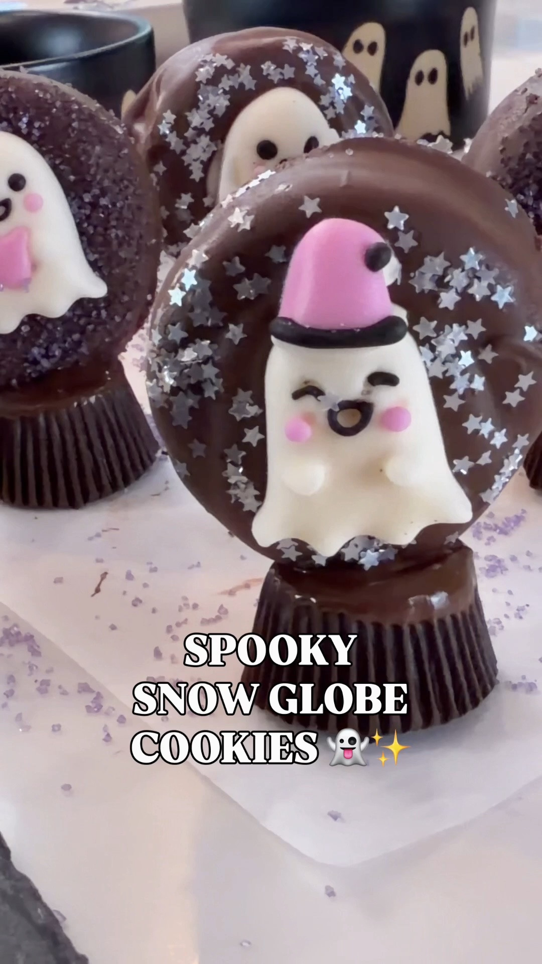 👻✨ SPOOKY SNOW GLOBE COOKIES!! These might be the most fun Halloween cookies I’ve created yet—and they’re SO easy to make! 🍪

Dip Oreos in melted dark chocolate, add ghost icing decorations, then sprinkle with sanding sugar + little star sprinkles to create that magical snow globe effect! ✨ Finish with a dark chocolate peanut butter cup on the bottom for the cutest little snow globe base.

Such a fun Halloween treat for parties, spooky movie nights or making with the kids! 🎃👻

🛒 Linking what you need to recreate them!

#LTKHalloween #HalloweenTreats #HalloweenCookies #SpookySeason #EasyHalloweenTreats #LTKFamily

#LTKSeasonal #LTKHome #LTKfoodie