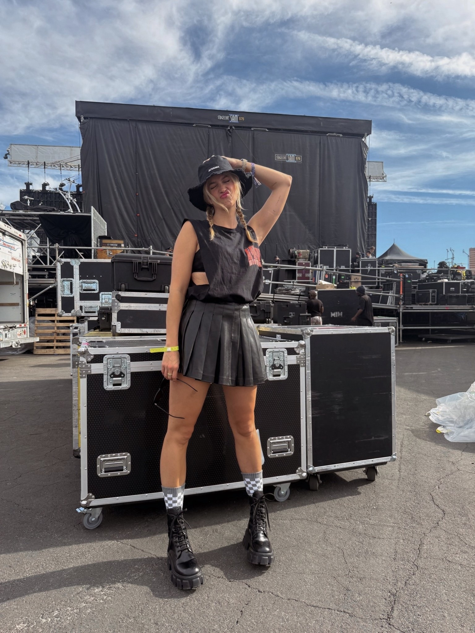 borrowed one of ty’s metal tees and did my best to fit in at @whenwewereyoungfest 😅 vegas heat had me throwing on a bucket hat and mesh bra for function more than style, but we made it work. skirt’s an older faux leather find (linked some newer ones) and these platform combat boots are my forever go-to splurge + save options linked 🖤

#LTKStyleTip #LTKShoeCrush #LTKTravel