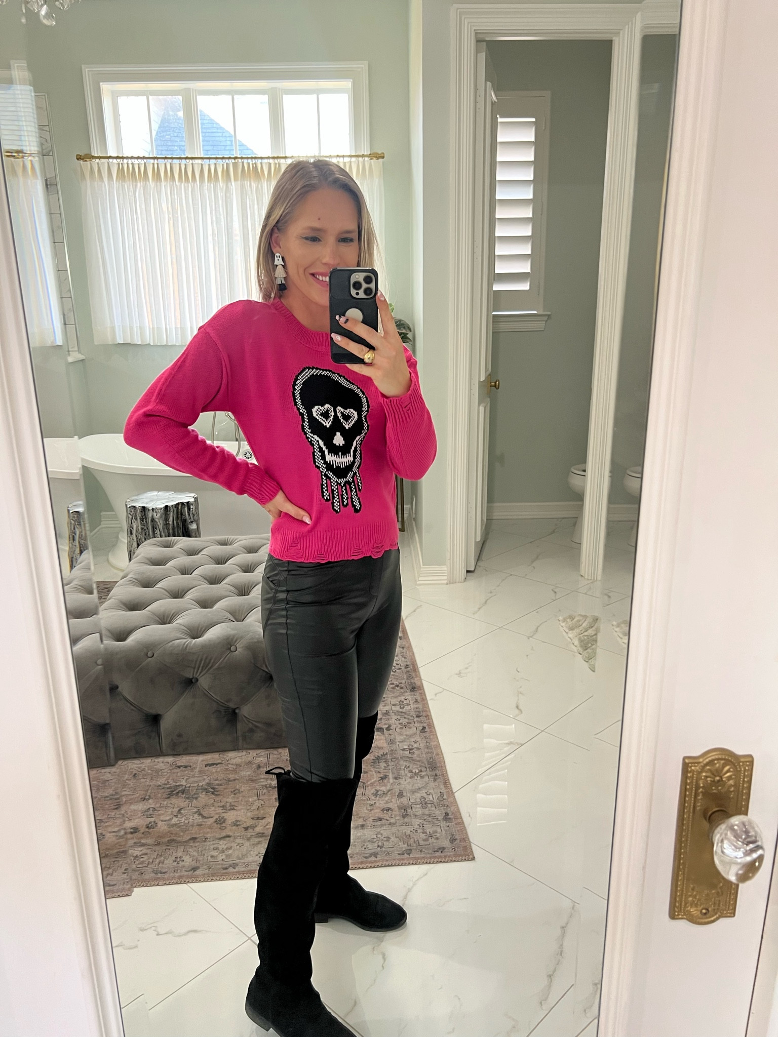 Cute pink skull Halloween sweater for under $15 paired with faux leather leggings and over the knee flat suede boots 

#LTKstyletip #LTKSeasonal #LTKHalloween