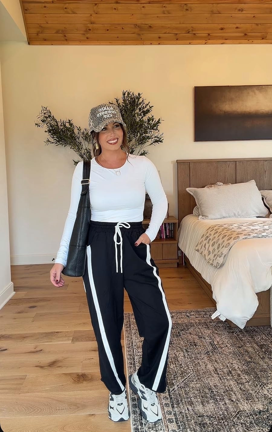 Sporty, comfortable, and so easy to wear! These striped track pants paired with a fitted white top, chunky sneakers, and camo hat make the perfect everyday athleisure outfit.
#AthleisureOutfit #TrackPants #SportyChic #CasualStyle #EverydayOutfit #LTKStyleTip #LTKFinds