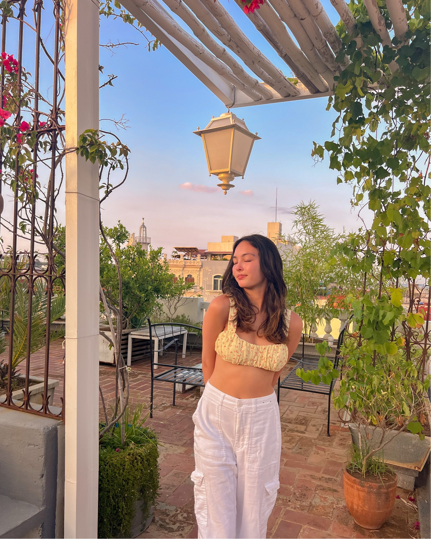 Princess Polly code: ANYA20

yellow floral crop tank top 
white baggy pants

top: size 2
pants: size xs

height: 5’3