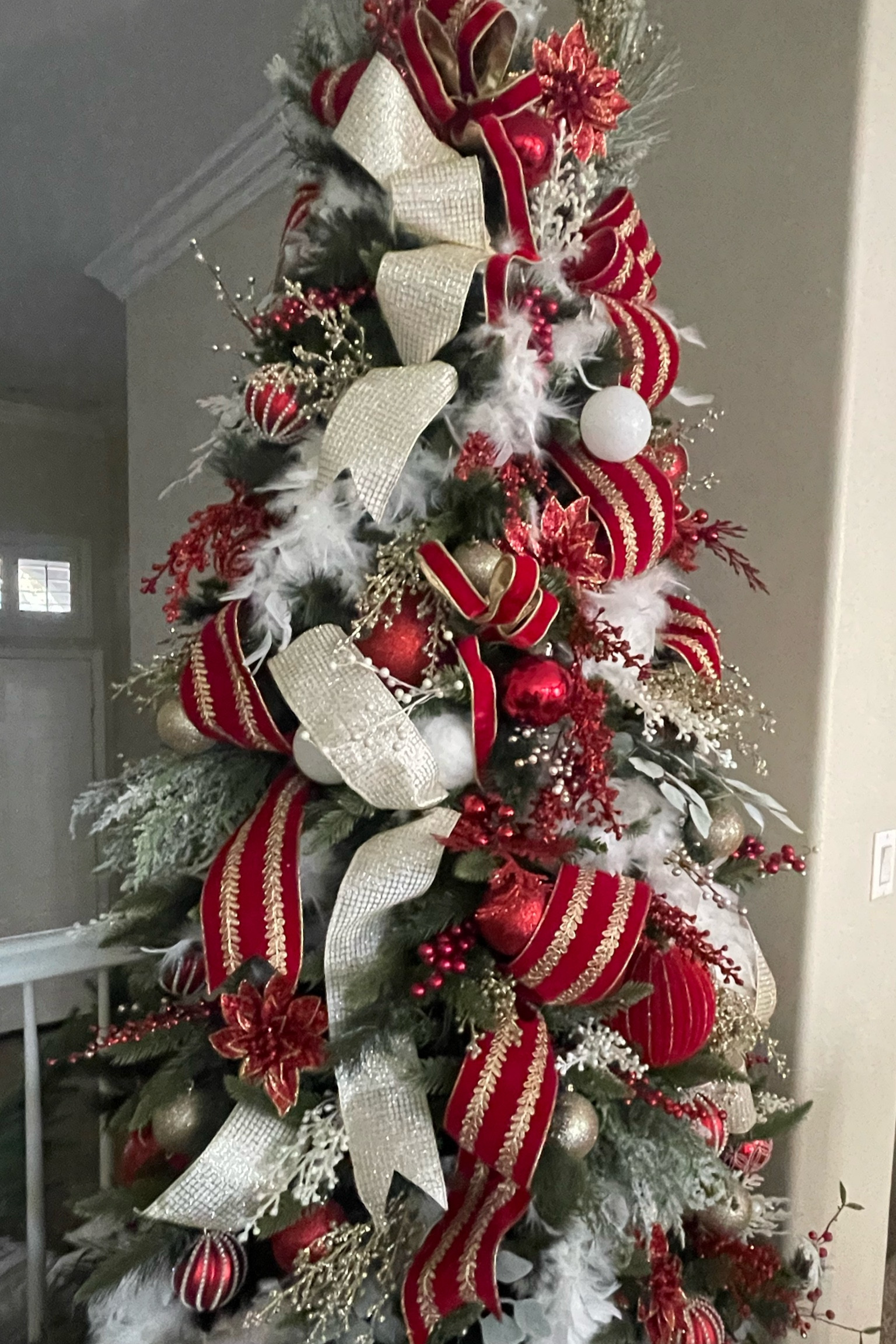 Classic red and gold Christmas tree. We used ribbon, boas, picks and ornaments.

#LTKhome #LTKSeasonal #LTKHoliday