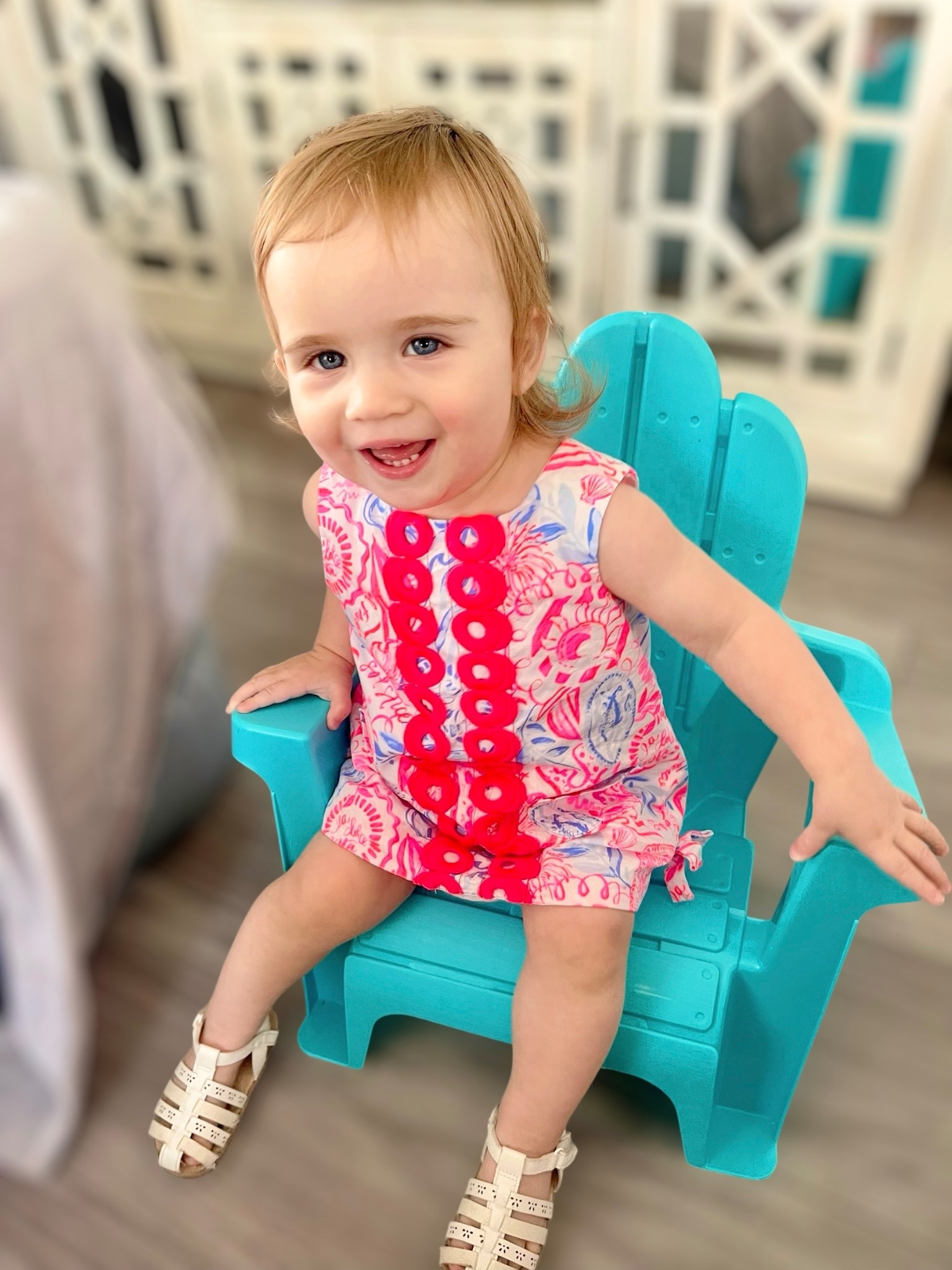 🎀 Toddler style in full bloom! This sweet shift romper is from Lilly Pulitzer, featuring the signature bright floral + seashell print in pink, coral, and periwinkle 💗🩷💙 The oversized hot pink button detailing down the front adds the cutest coastal charm! It’s a bubble romper fit with side ties and bottom snaps for easy diaper changes. She’s wearing size 12–18M. 👶🌺

🪸 Paired with classic white woven sandals—perfect for summer playdates or beach vacations! 🐚☀️

📸 Sitting pretty in a turquoise Adirondack-style toddler chair that adds a pop of beachy fun indoors or out! 🪑🏖️



#LillyPulitzer #ToddlerStyle #CoastalKids #MiniStyle #BubbleRomper #MommyAndMe #PreppyBaby #LTKBaby #SummerStyle #BrightAndBold👶🌴

#LTKBaby #LTKKids #LTKFindsUnder50