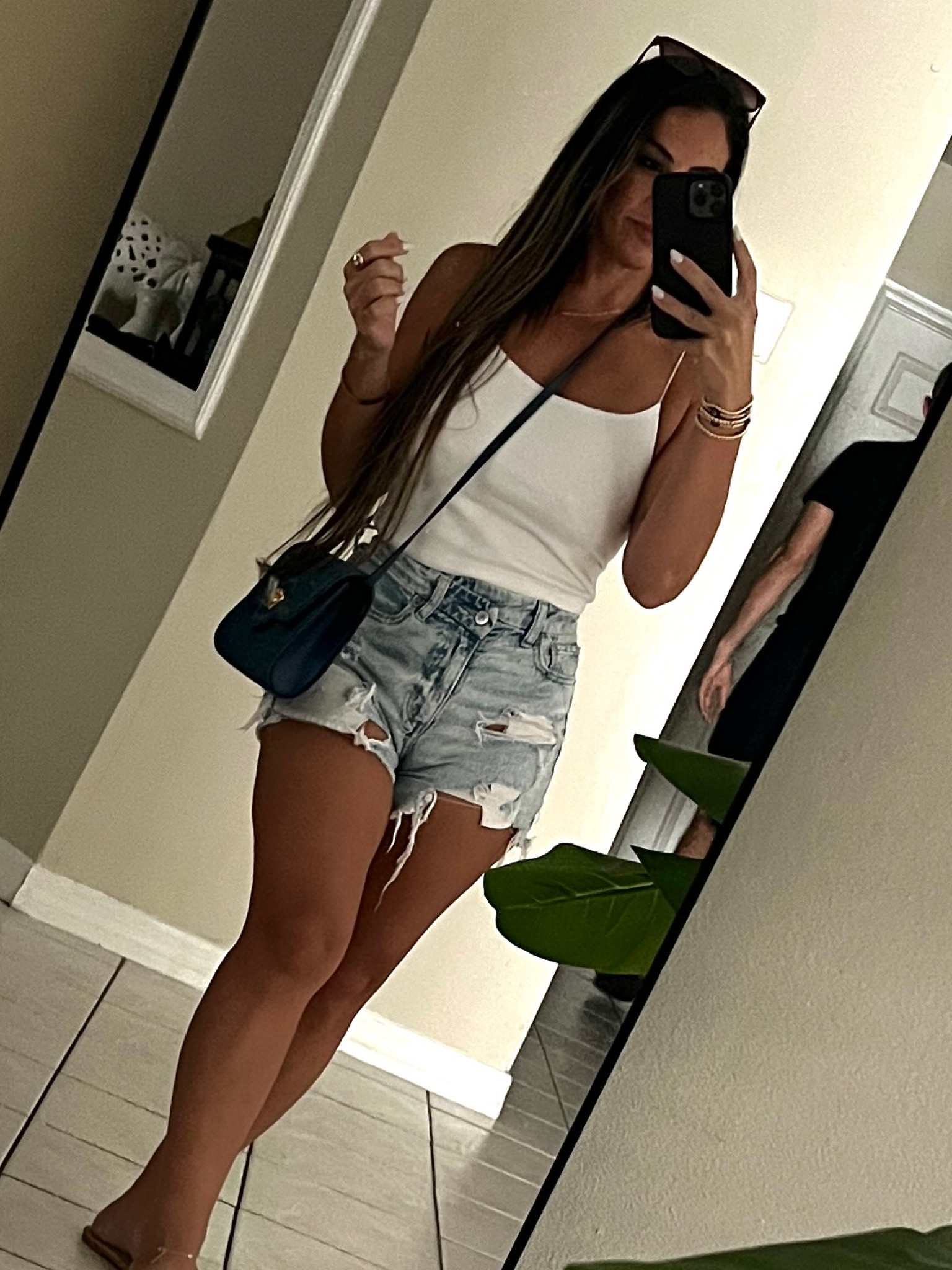 Ripped jean shorts, cropped cami for endless summer vibes 🤍 size ref: S cami, 00 jean shorts

#LTKStyleTip #LTKFallSale