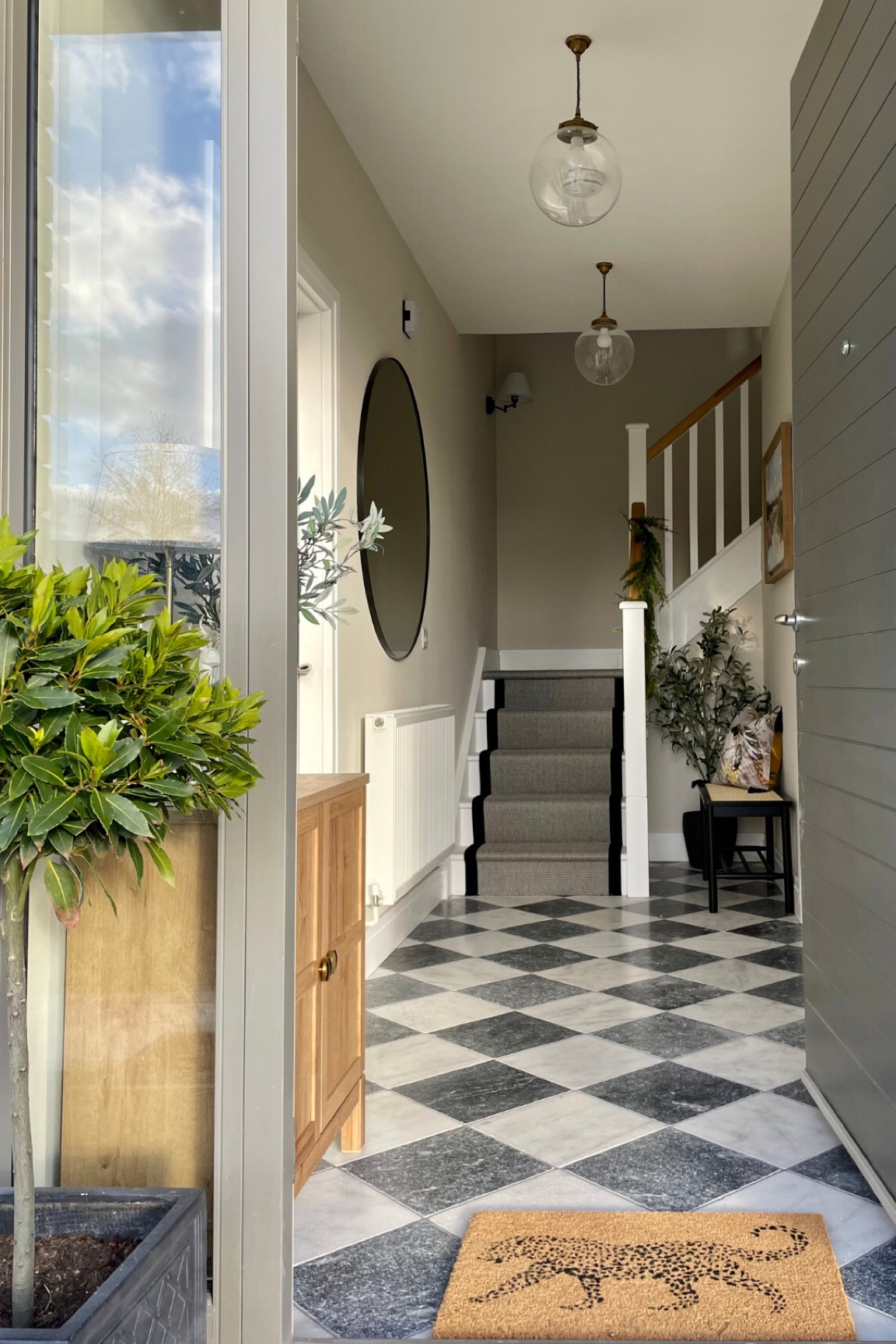 Monochrome decor hallway, sideboard, faux tree, large round mirror, faux stems, vintage artwork,  Marks and Spencer, Dunelm, IKEA 

#LTKhome #LTKFind #LTKunder100