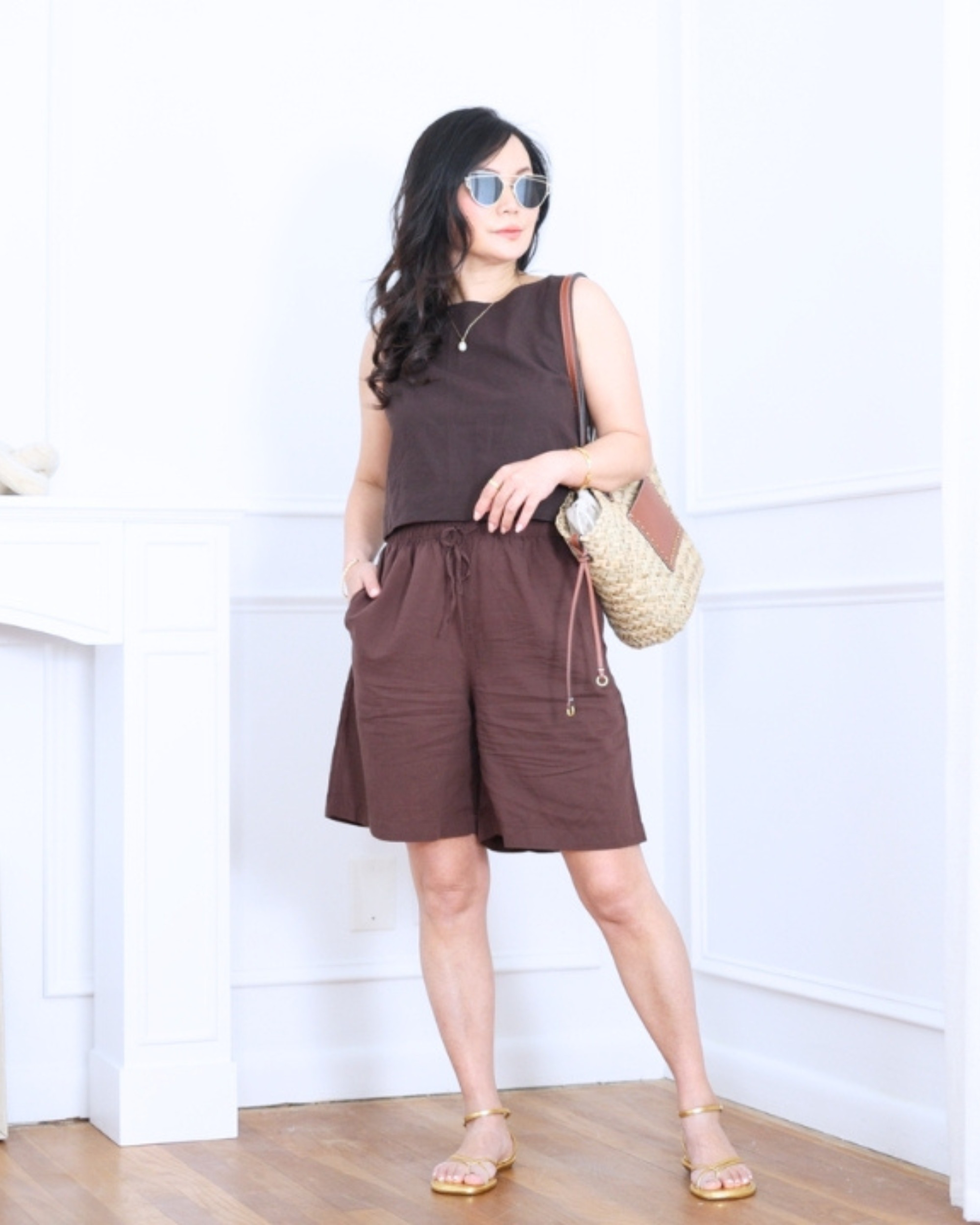 Brown shell top from GAP paired with shorts from Uniqlo — simple, easy, and effortlessly chic. A relaxed warm-weather look that feels comfortable, polished, and ready for whatever the day brings. I'm 5'2, wearing size S. 

 #LTKootd #LTKOver40 #LTKPetite