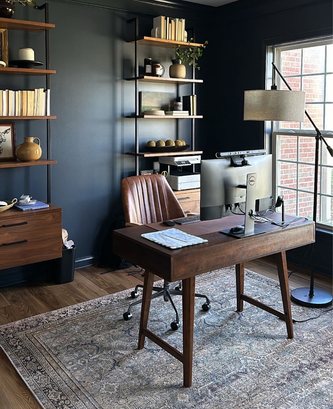 Cory’s office! We still have a ways to go and I’d love for these shelves to eventually be built-ins, but for now - he’s loving it!  

Wall color: Hale Navy by BM in Eggshell
Trim: Hale Navy by BM in Semi-Gloss

Office decor, office layout, office, office design, home decor