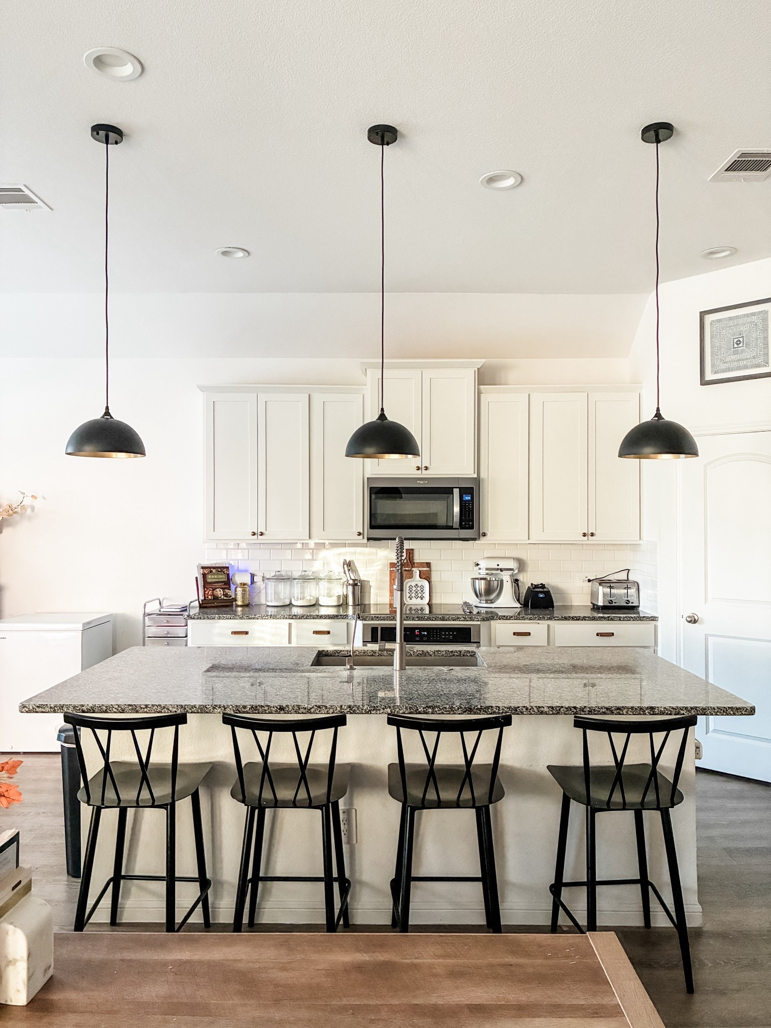 New pendant lights in our kitchen from Wayfair. I love that the dome has a gold inside and a black matte outside. And we have had our barstools for three years and they still look great! 

#LTKHome