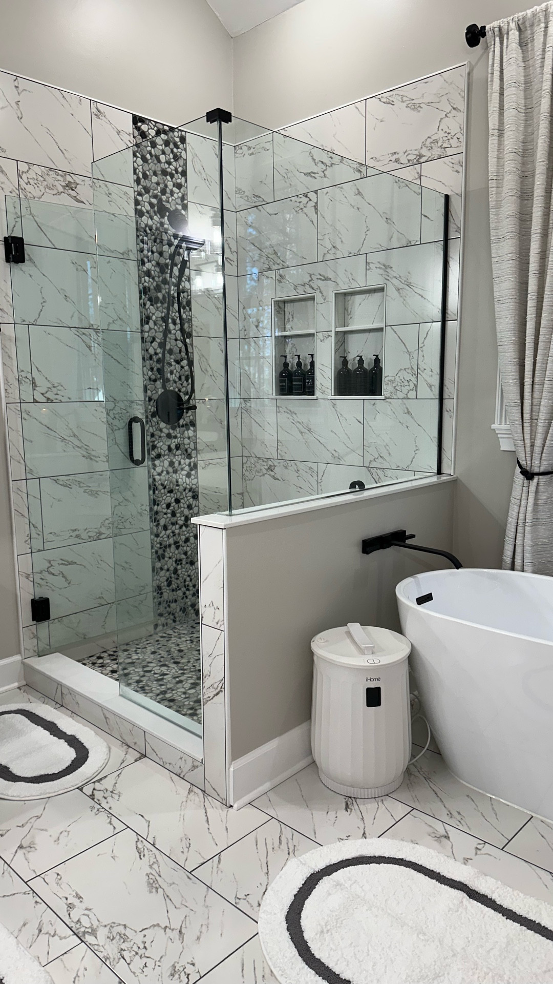 Our primary bathroom received a complete glow up! I want a stand a long tub and this one right here is a beauty. I also purchased a tub filler wall mount faucet set with the matte black and so much more. 

#LTKHome