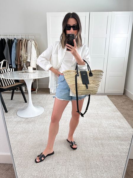 Easy outfit with a button down over tank. This is my favorite button down of all time. Oversized and the material is 🤌🏼. 

AYR shirt xs
Reformation tank xs
AGOLDE Dee shorts 26
Hermes Oran sandals 35
Paris 64 tote. Can’t be linked on here. 
YSL sunglasses  
