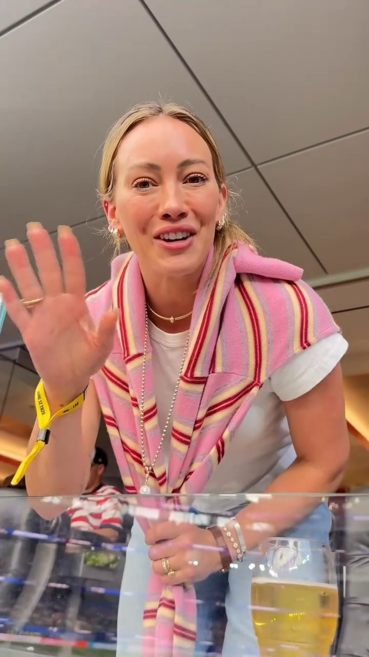 Hilary Duff's pink Collegiate striped cashmere polo sweater