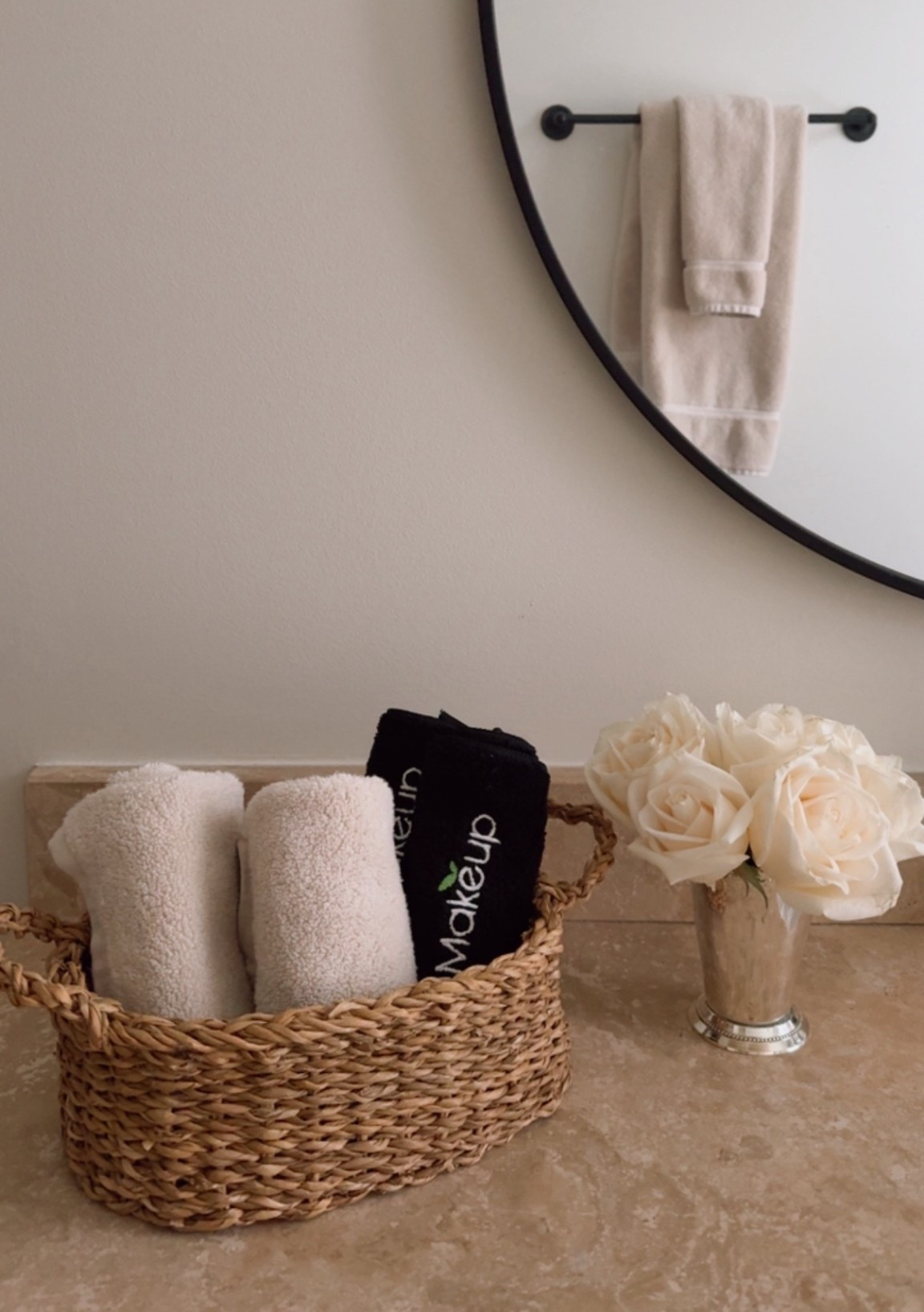 Guest bathroom details. Love having fresh flowers and a basket of wash cloths and makeup cloths. These almond colored towels are so soft and a great color. 